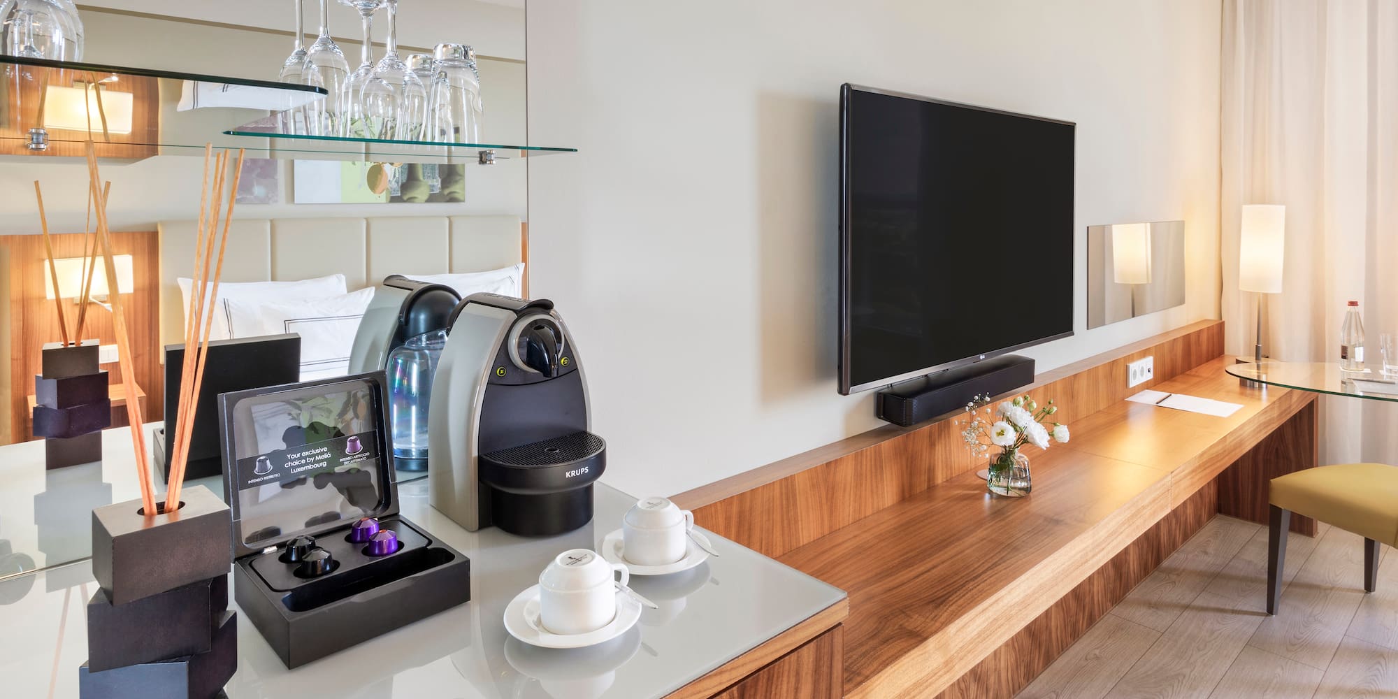 a room with a television and a coffee machine