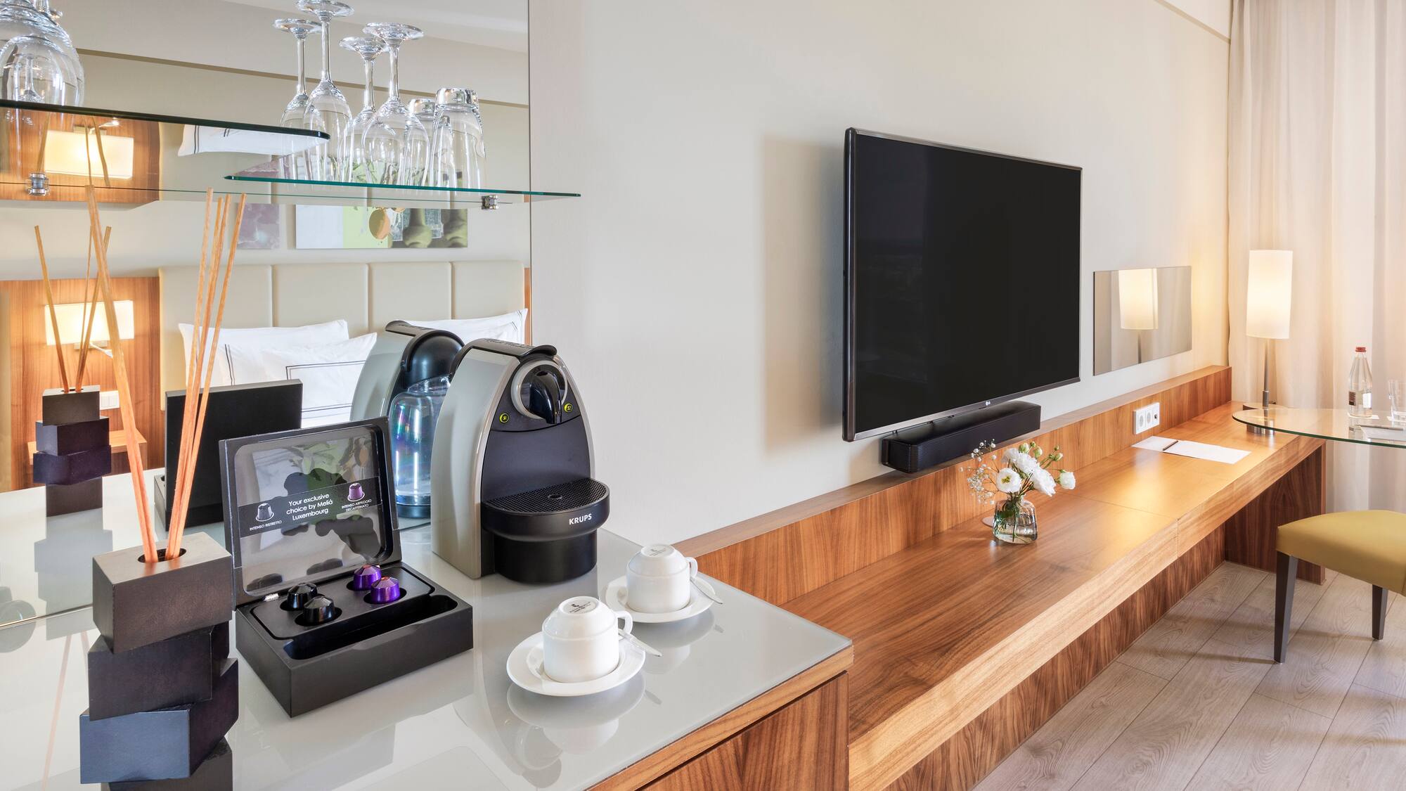 a room with a television and a coffee machine
