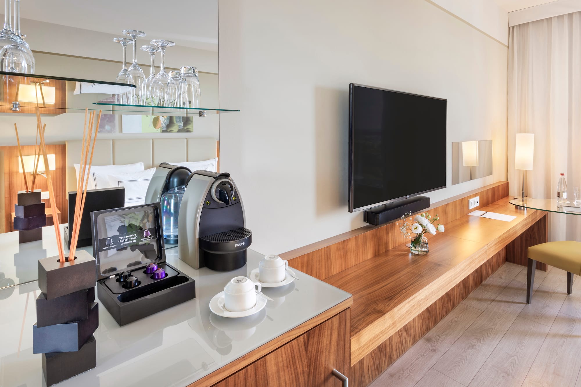 a room with a television and a coffee machine
