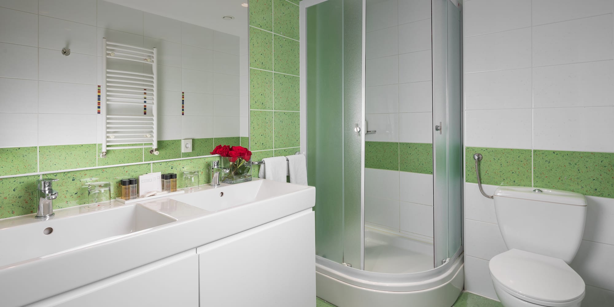 a bathroom with a shower and sink