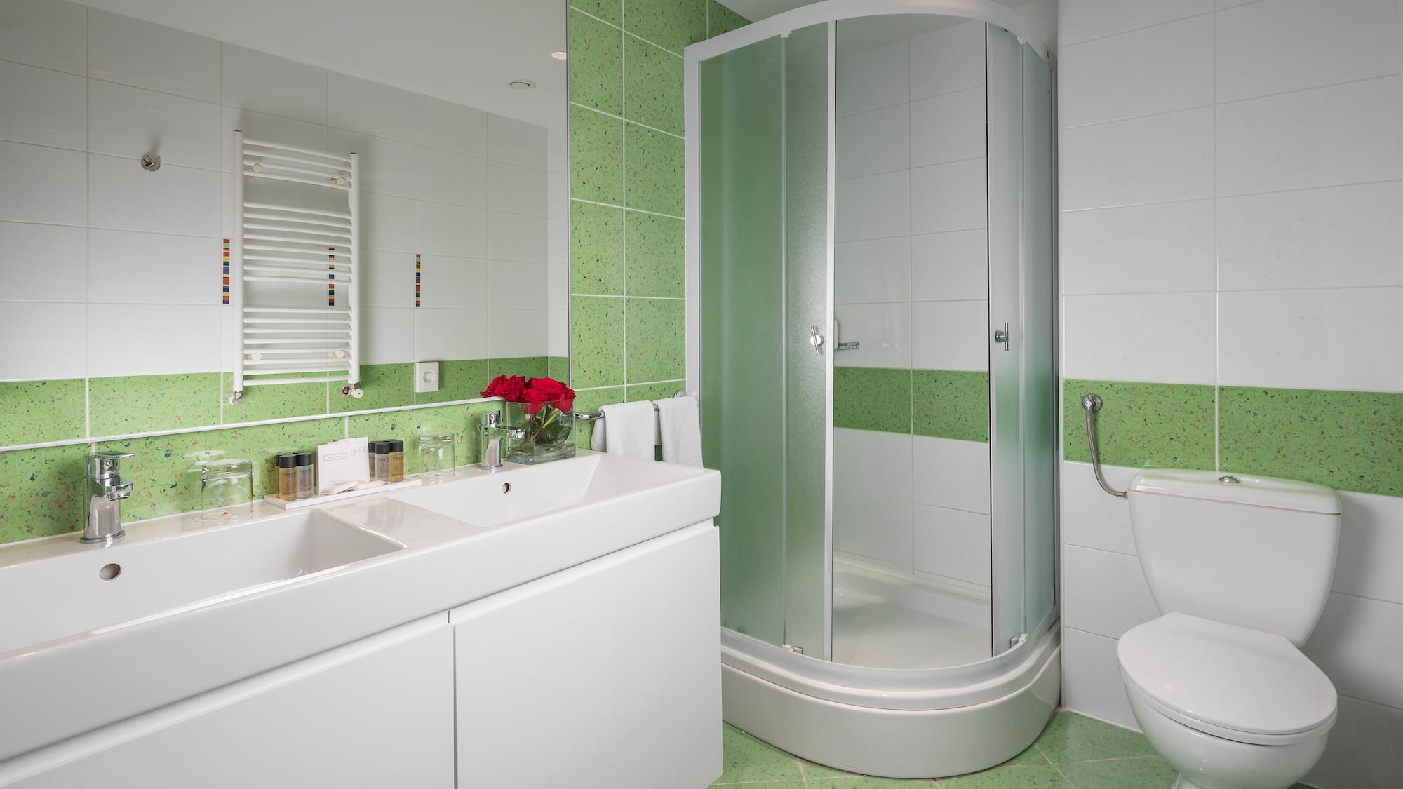 a bathroom with a shower and sink