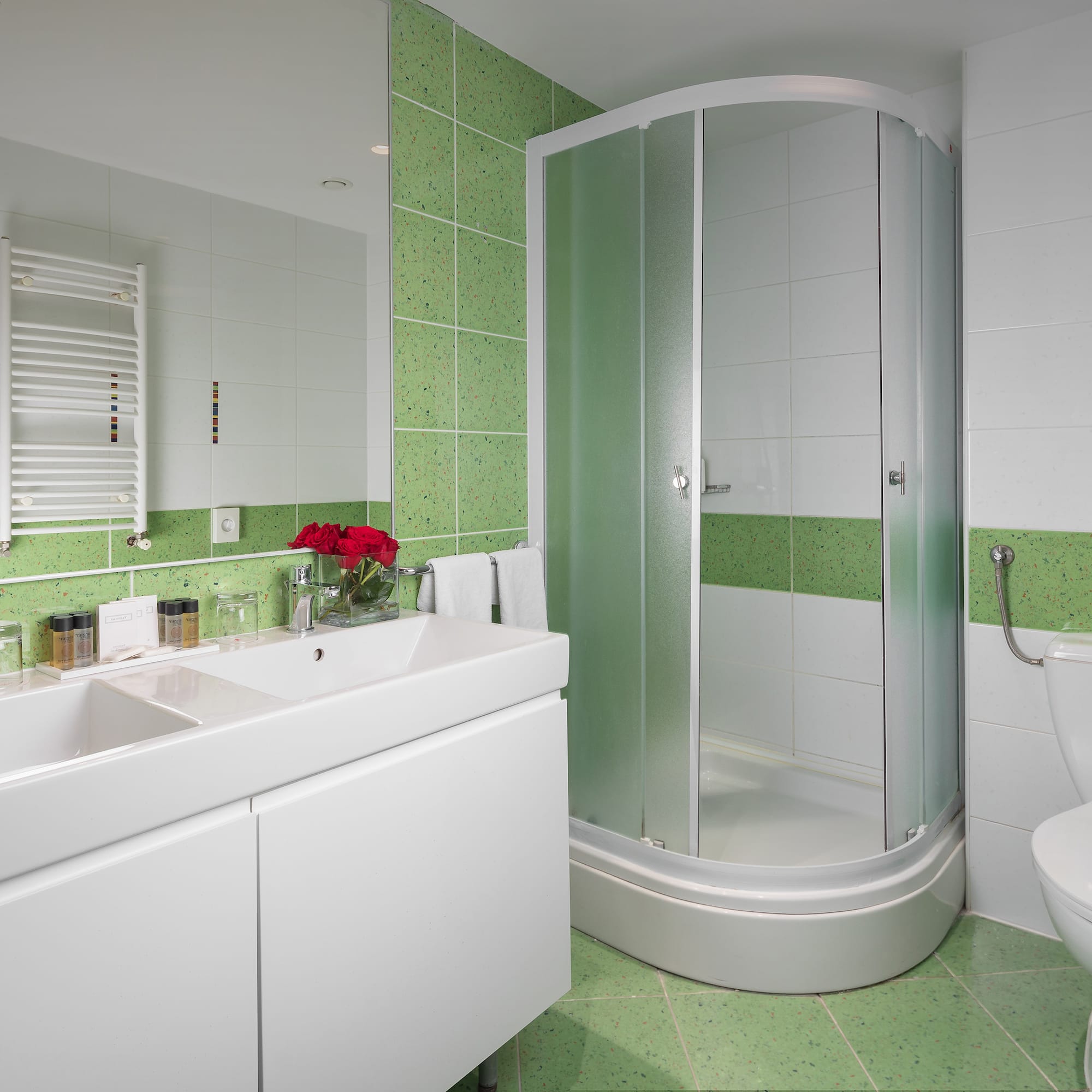 a bathroom with a shower and sink