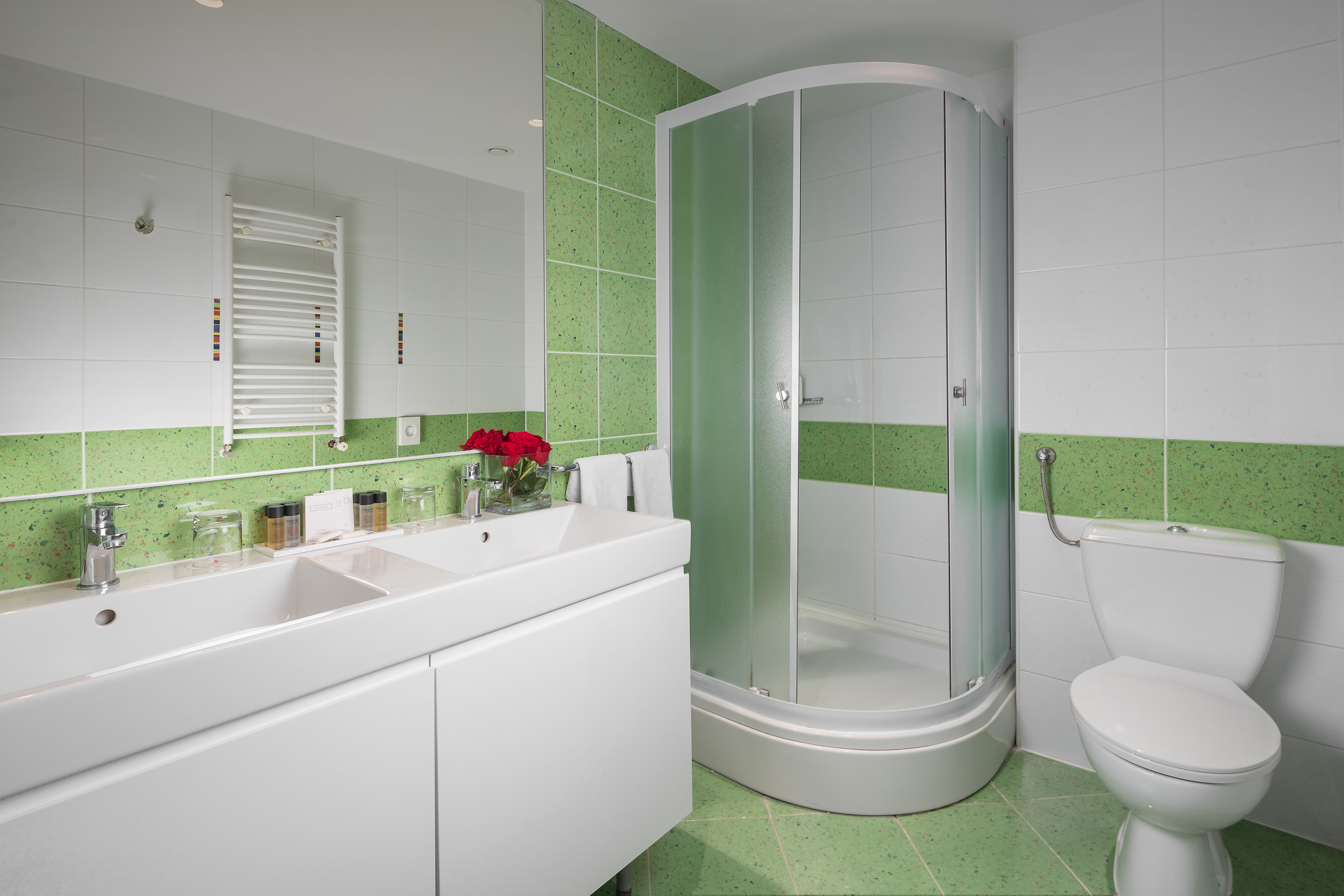 a bathroom with a shower and sink