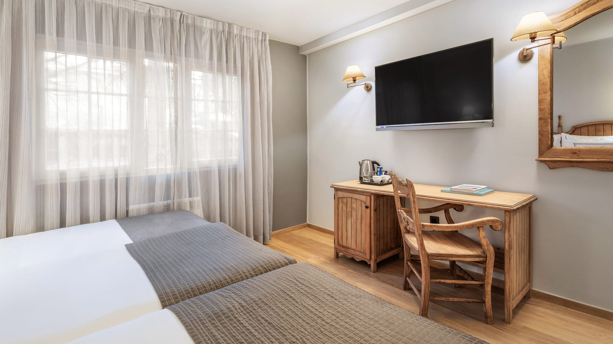 a room with a tv and a bed