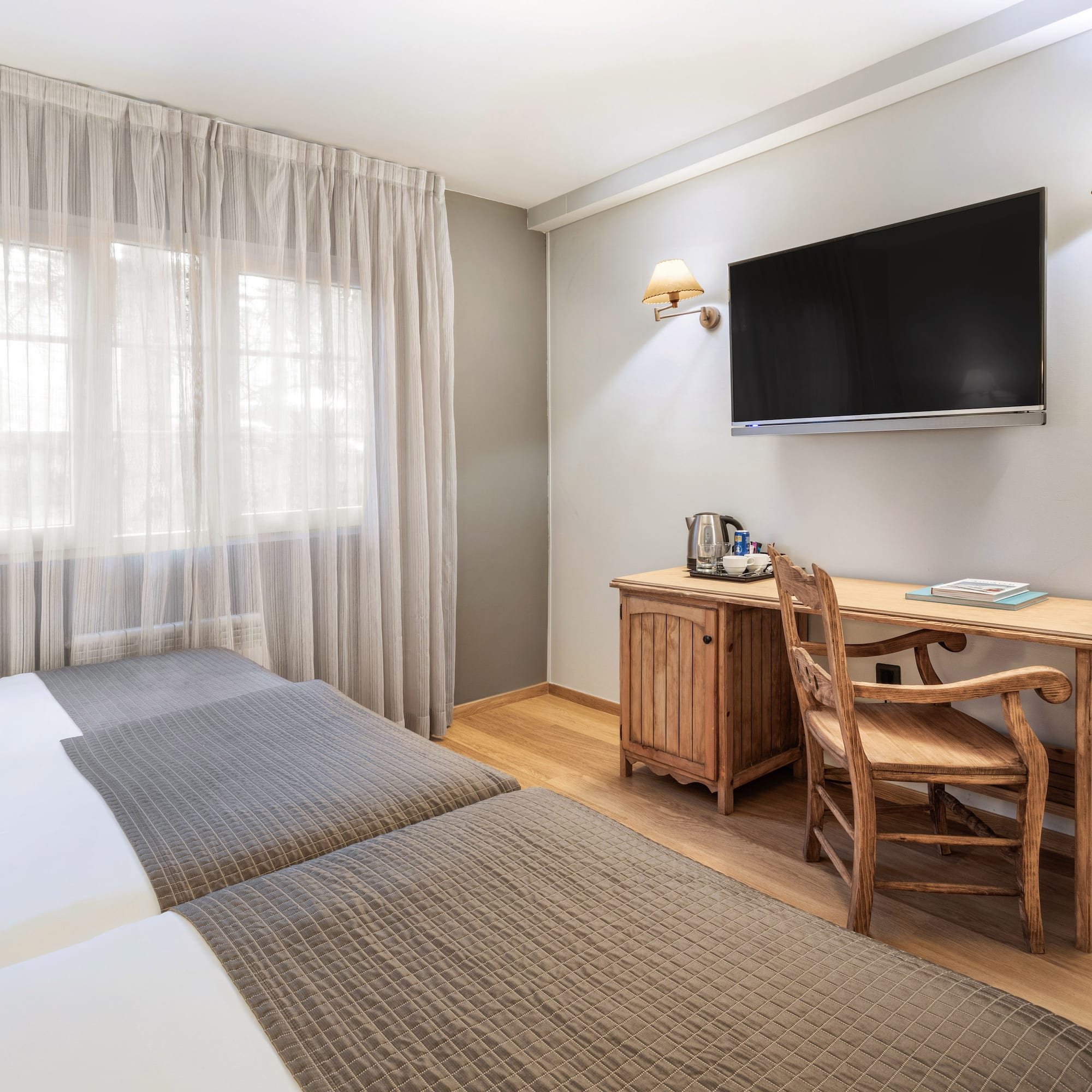 a room with a tv and a bed