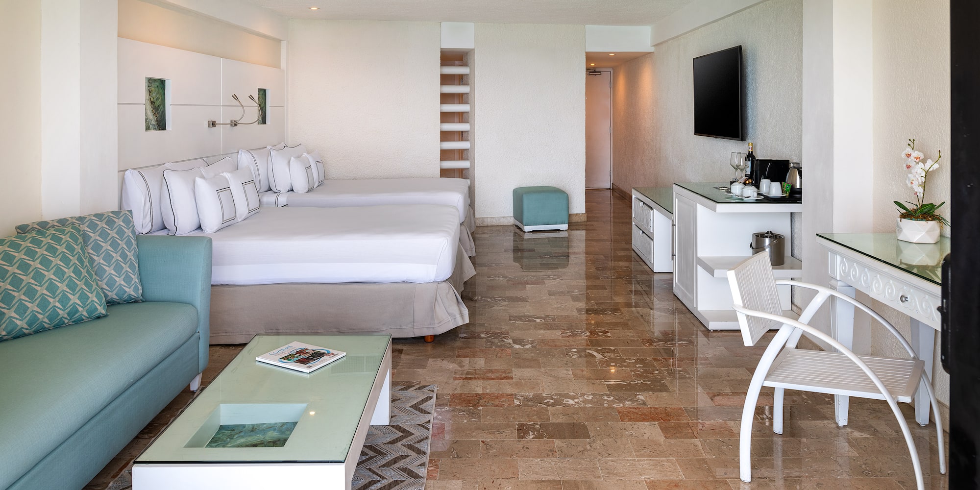 a room with a television and a bed