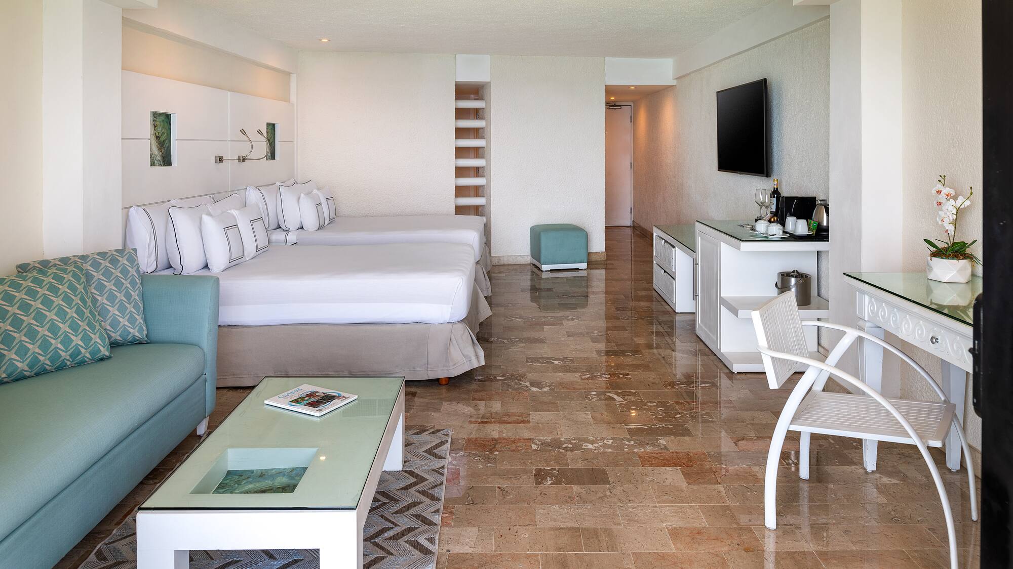 a room with a television and a bed