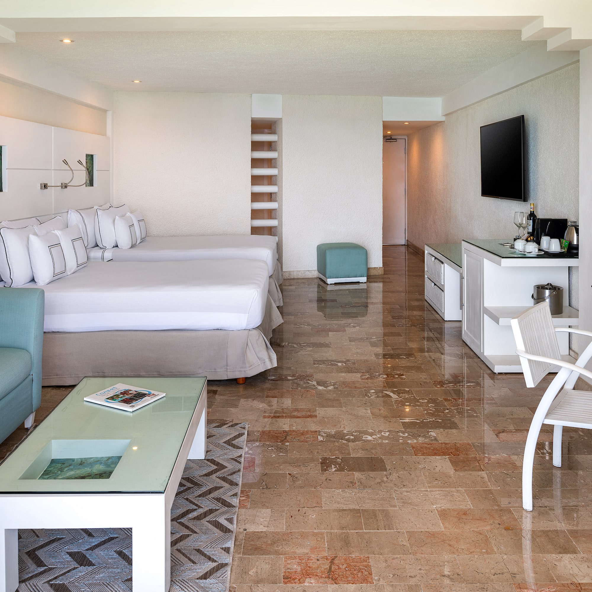 a room with a television and a bed