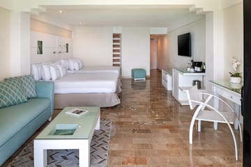 a room with a television and a bed