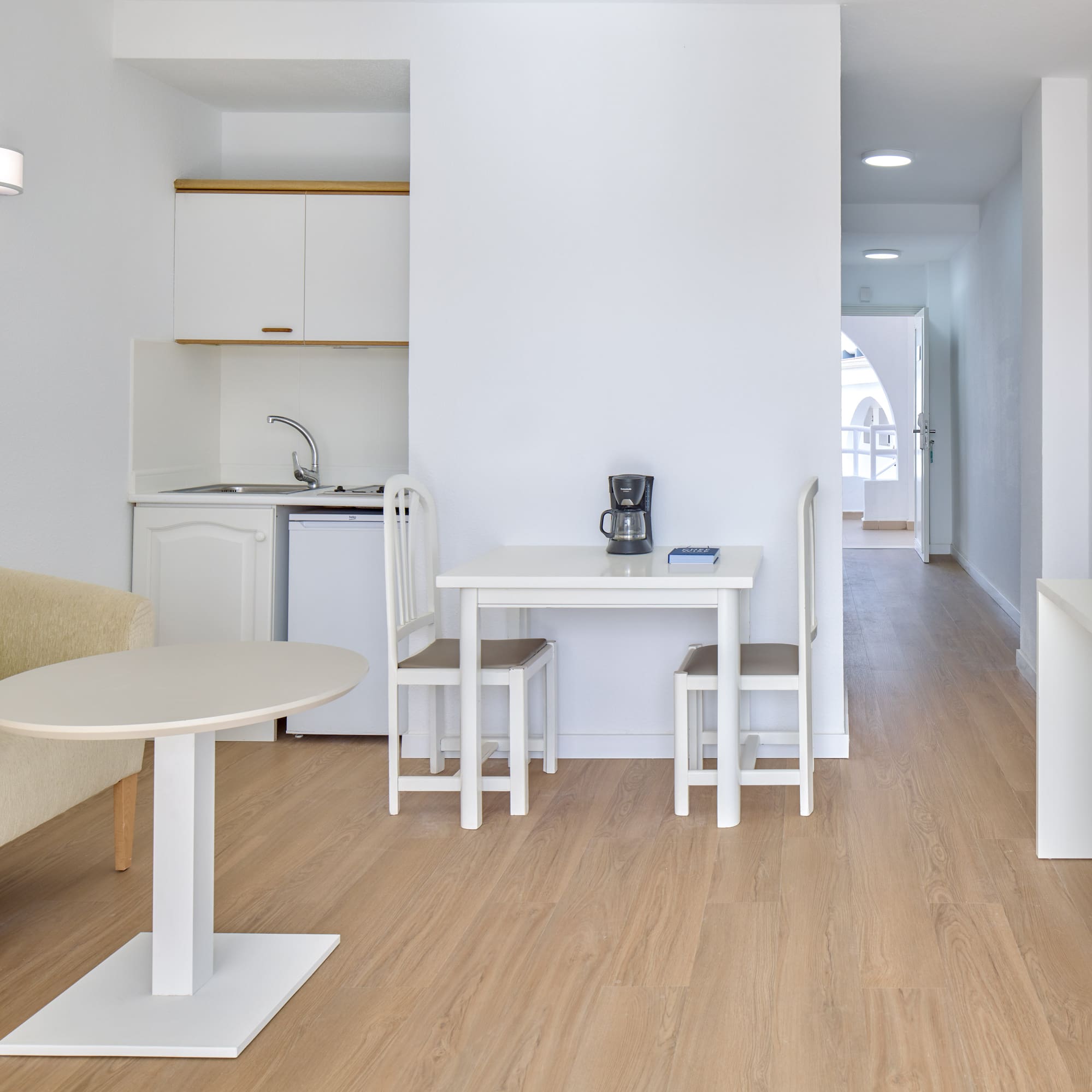 a room with a table and chairs