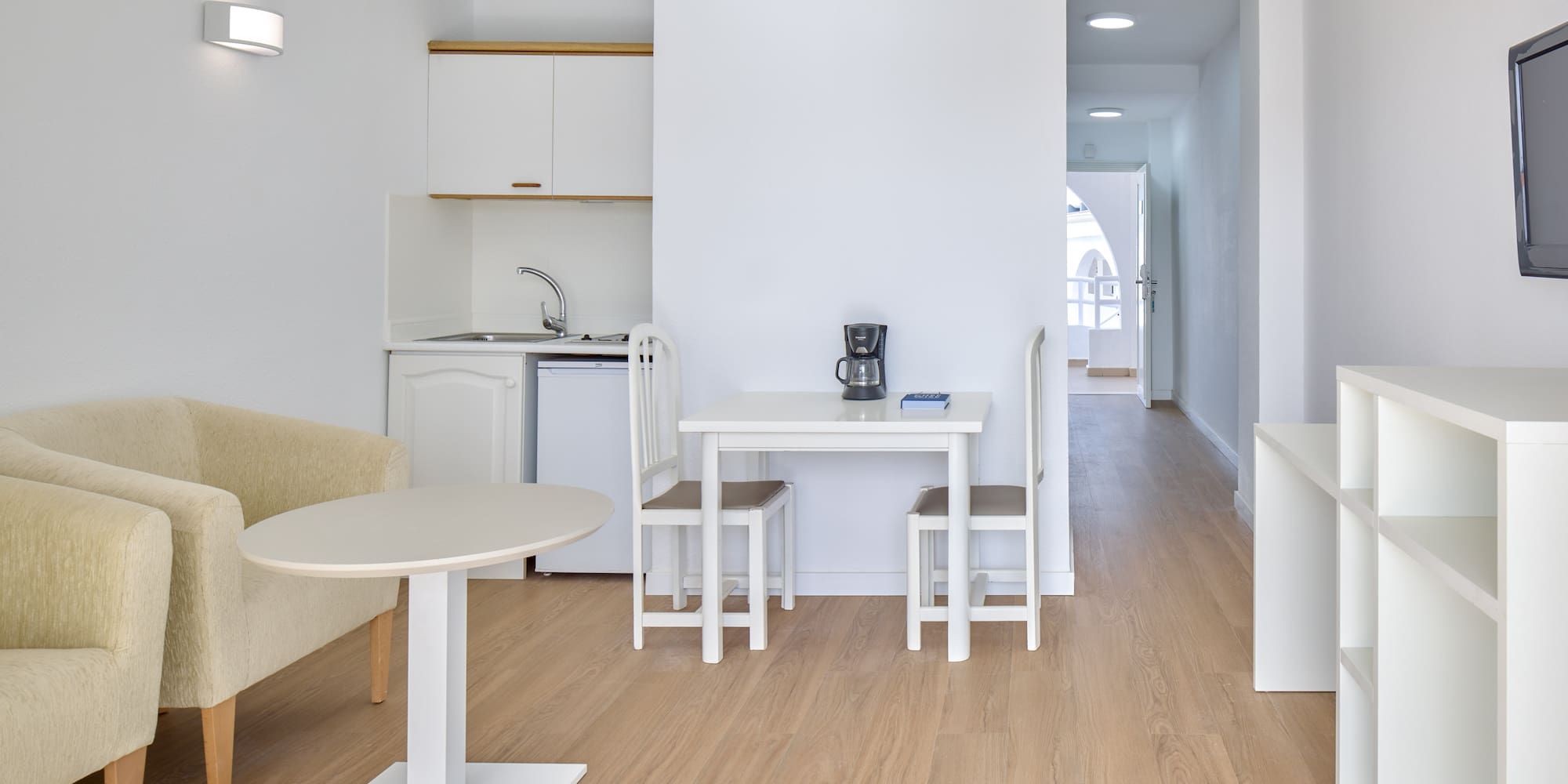 a room with a table and chairs