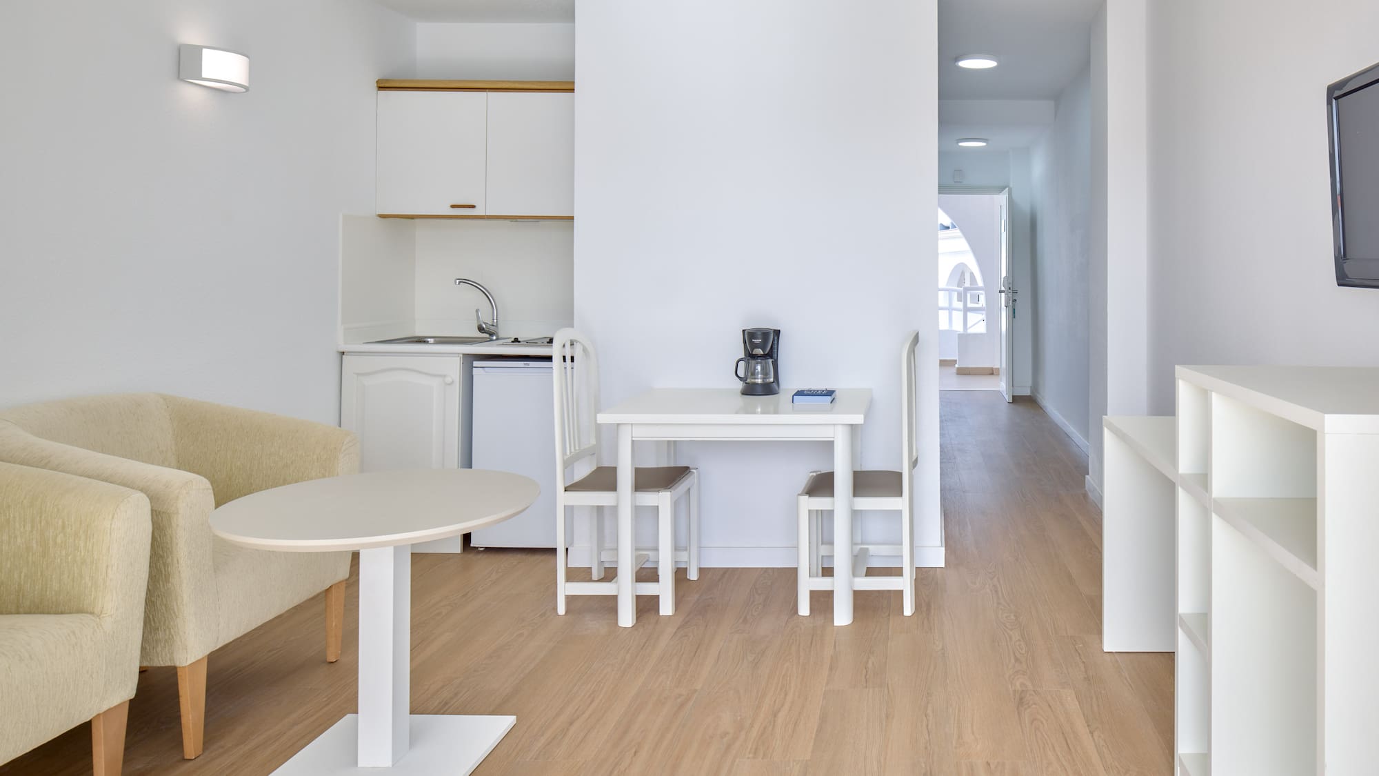 a room with a table and chairs