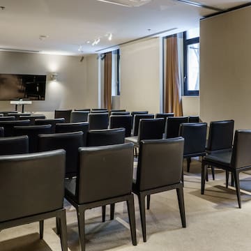 a room with black chairs