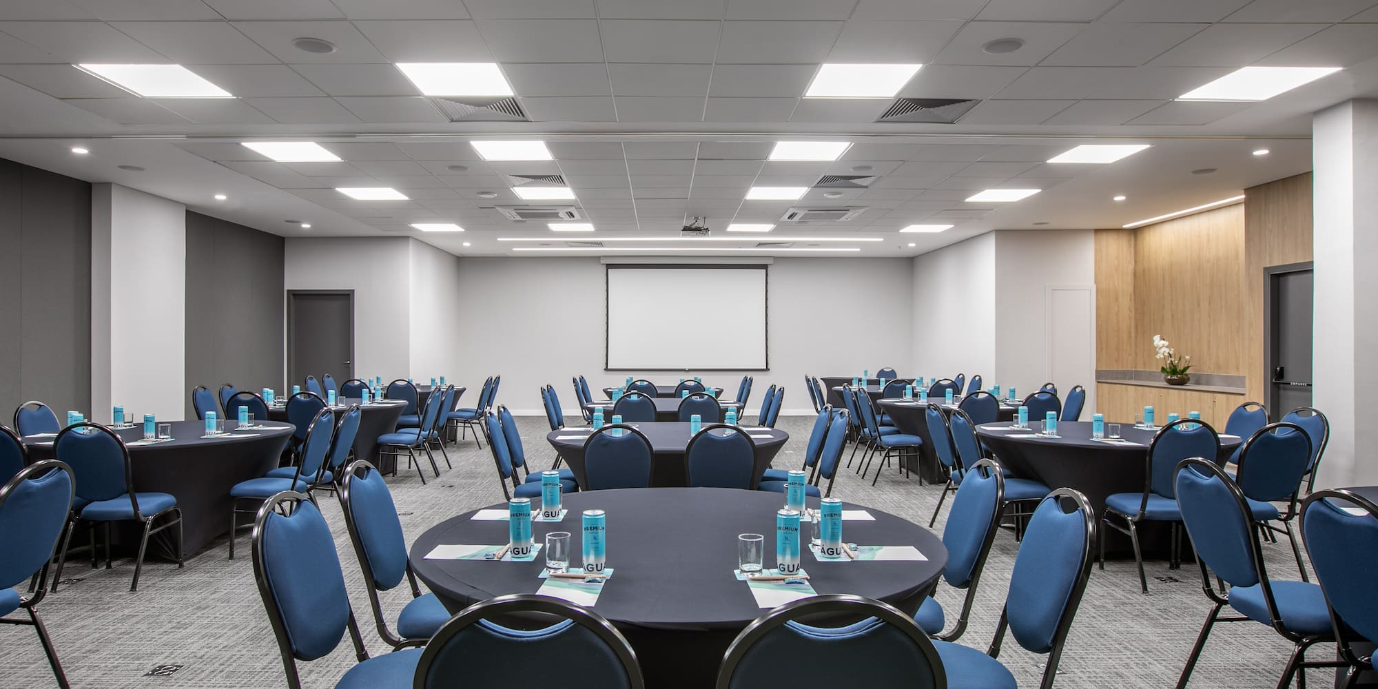 a room with round tables and chairs