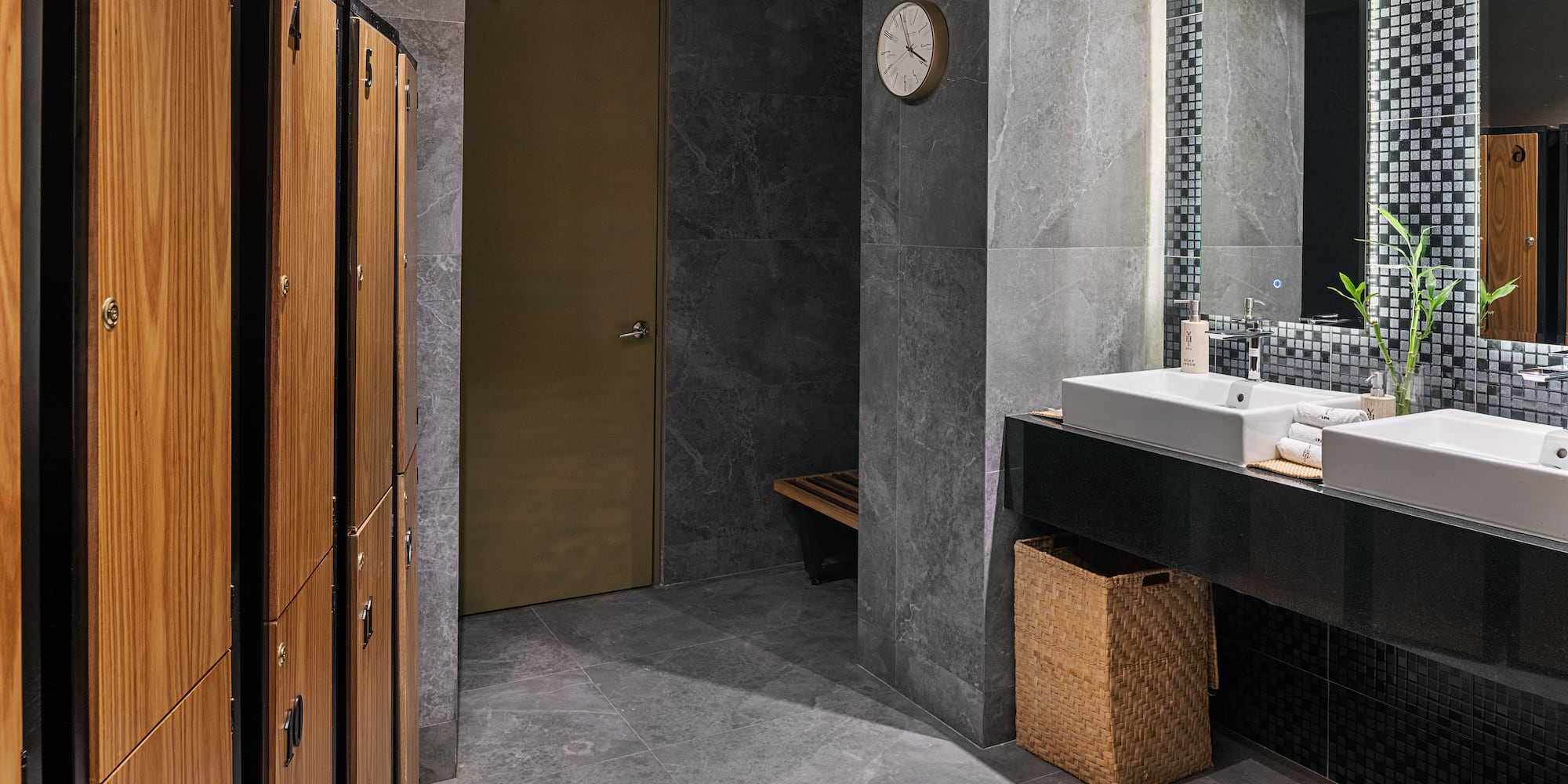 a bathroom with a sink and lockers