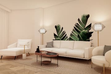 a living room with white couches and a coffee table