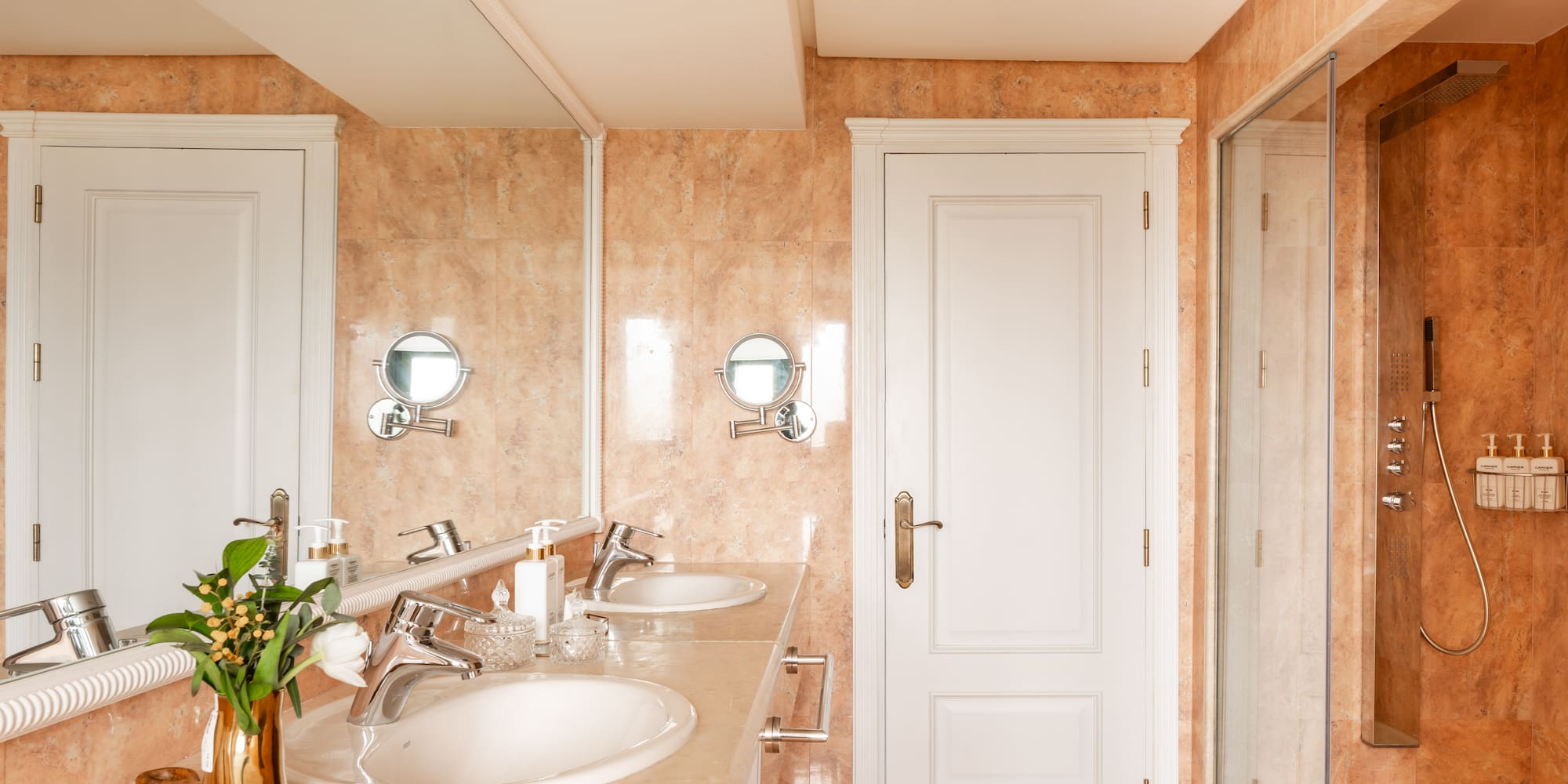a bathroom with marble countertop and sink