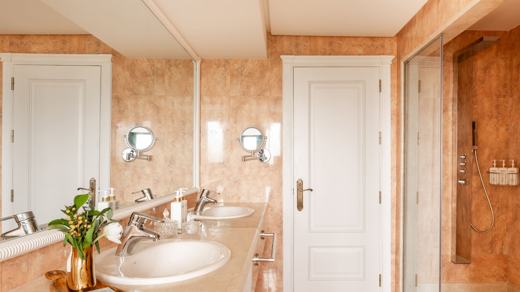 a bathroom with marble countertop and sink
