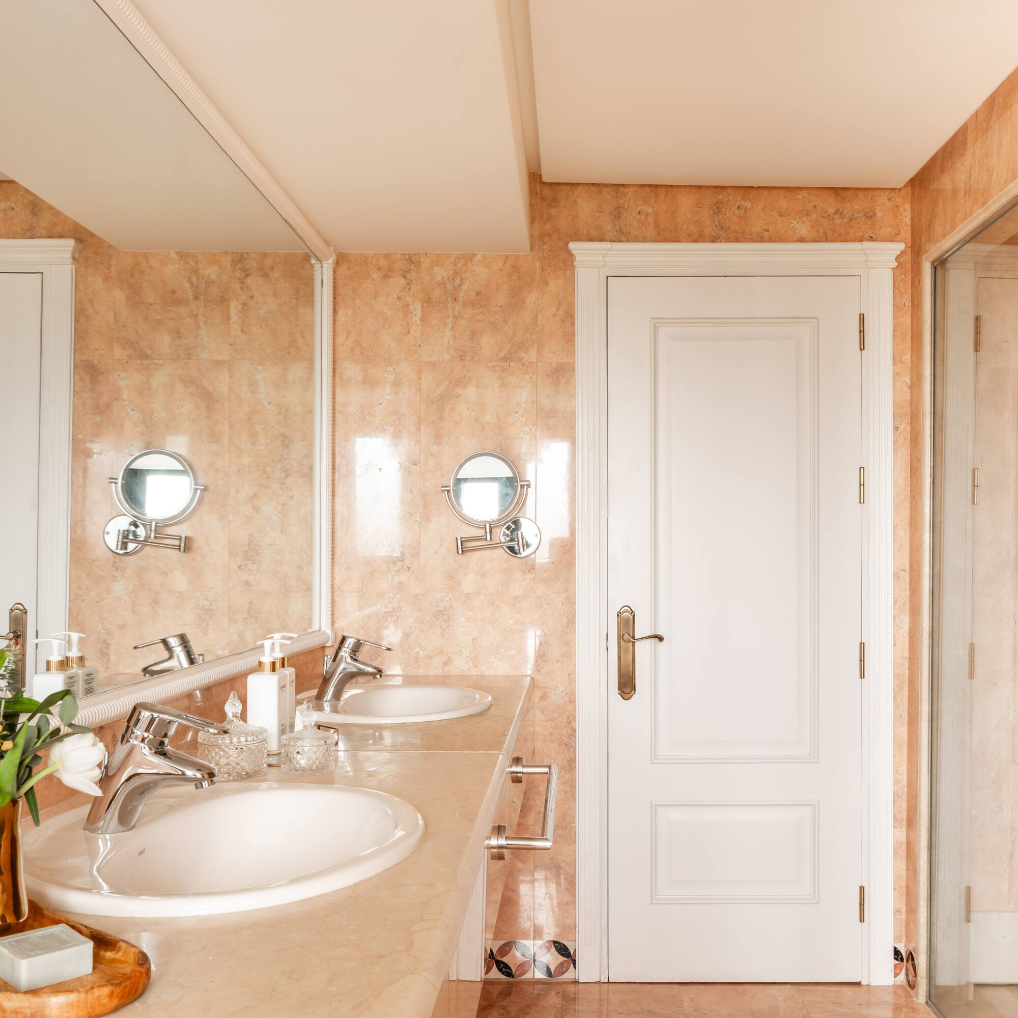 a bathroom with marble countertop and sink