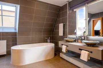 a bathroom with a tub and sink