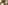Stylish attic bathroom with freestanding bathtub, dual glass vessel sinks.
