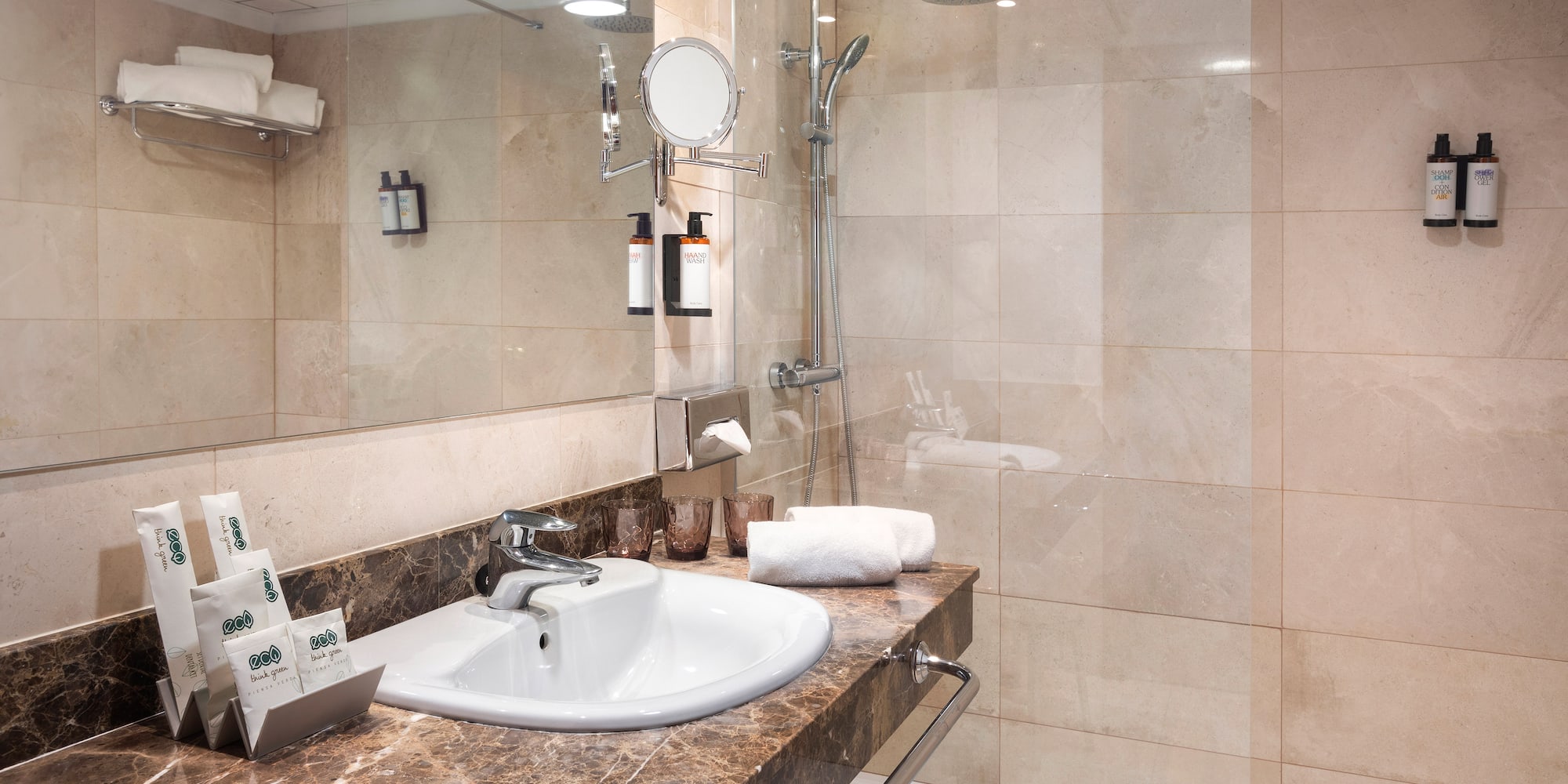 a bathroom with a shower and sink