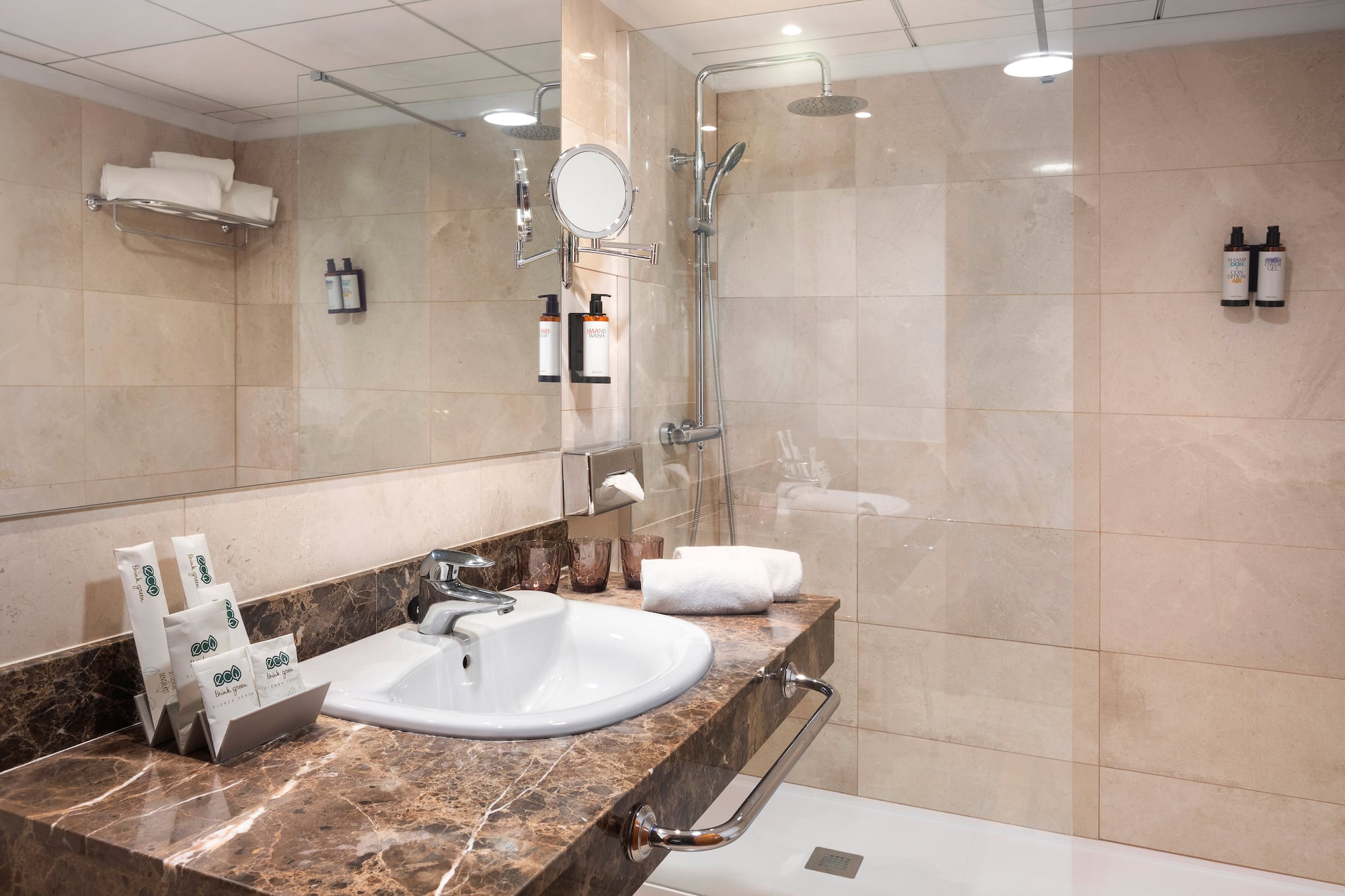 a bathroom with a shower and sink