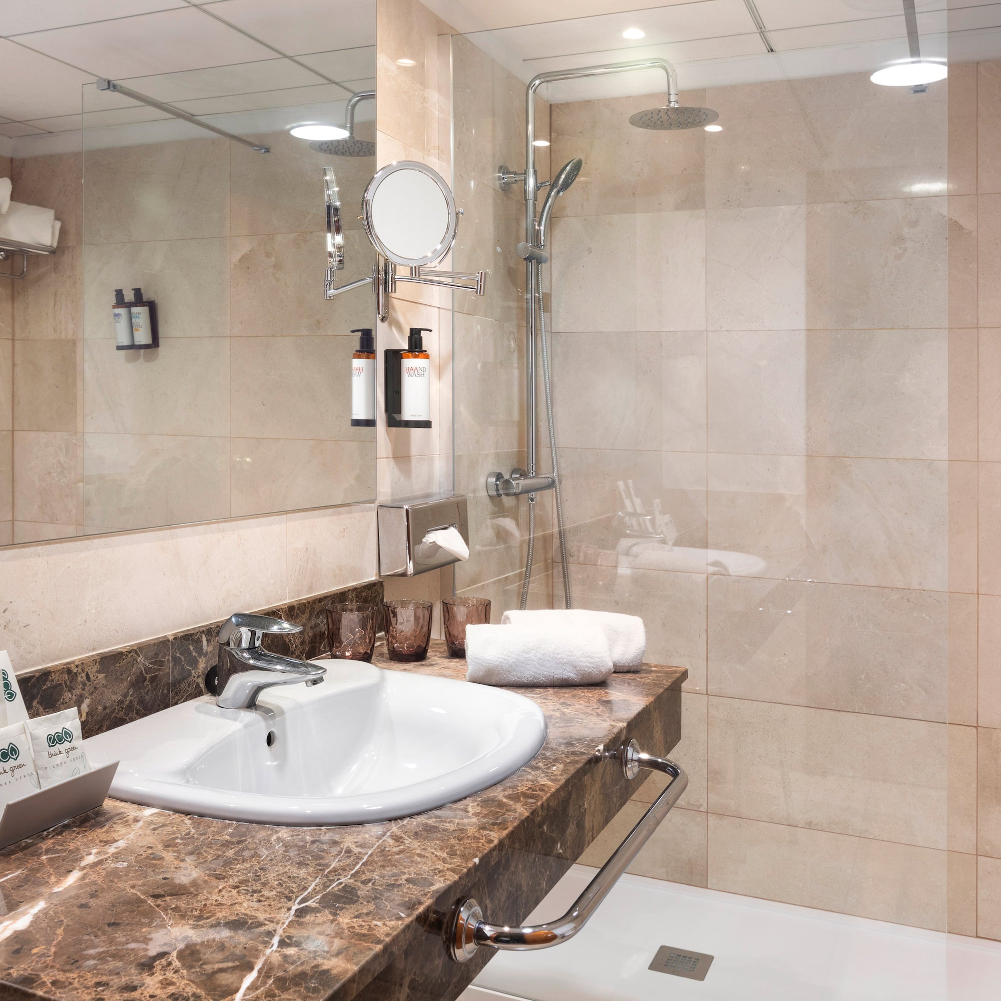 a bathroom with a shower and sink