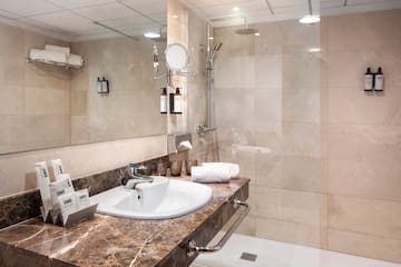 a bathroom with a shower and sink