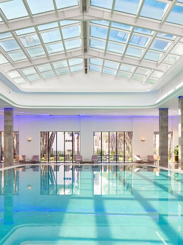 a indoor pool with a large roof