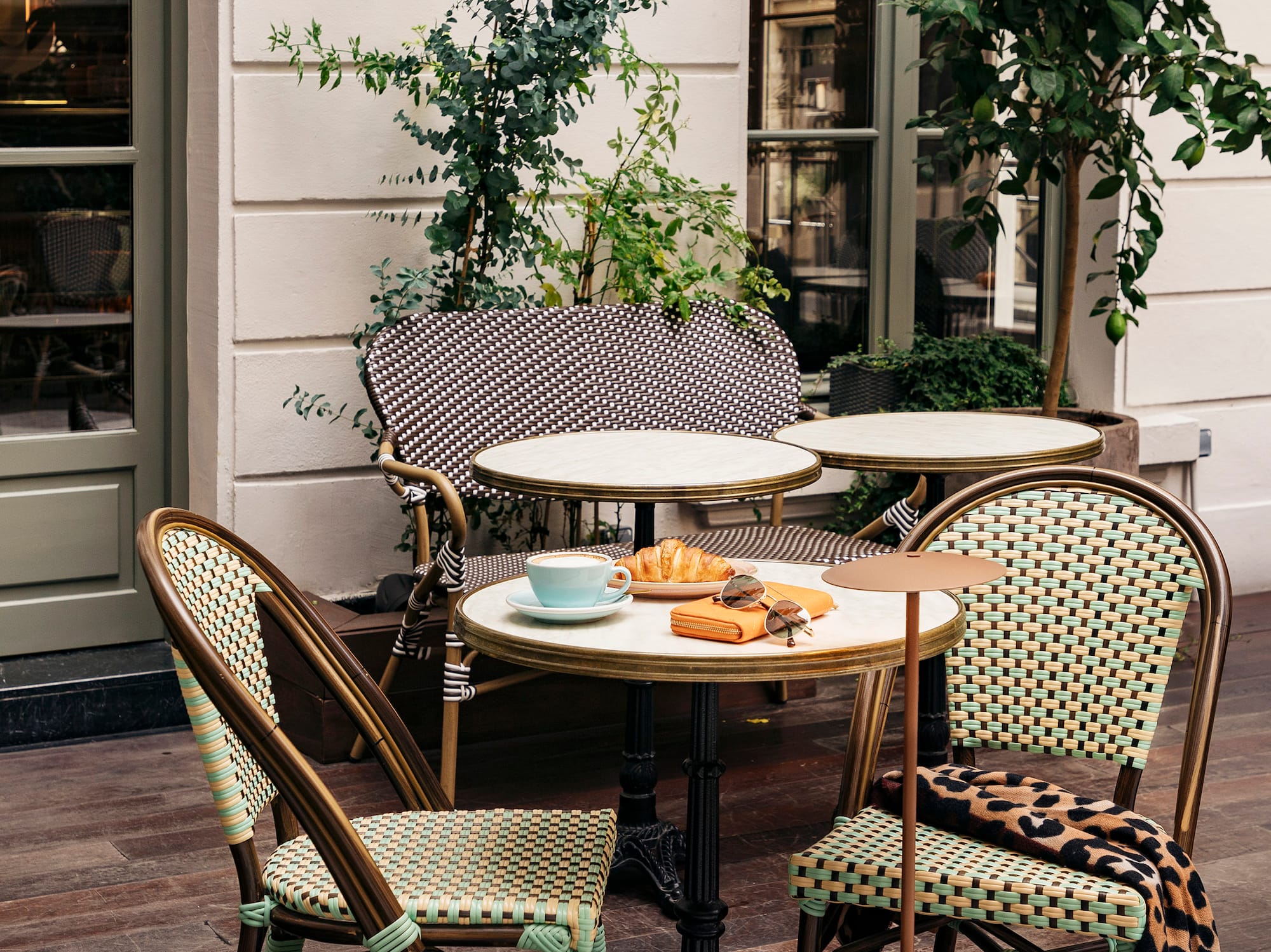 a table and chairs outside a building