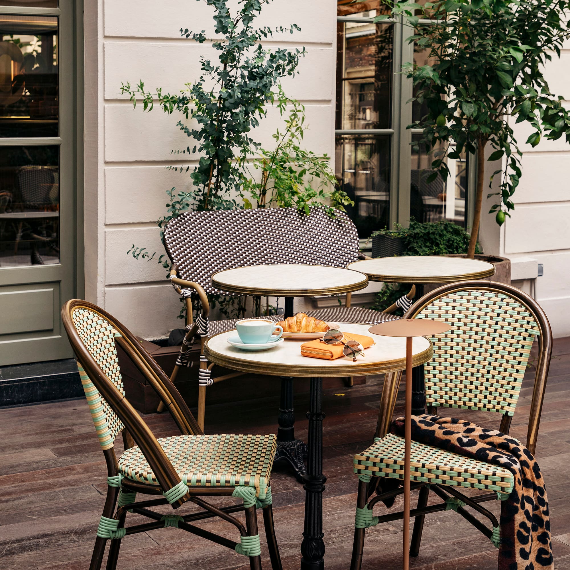 a table and chairs outside a building