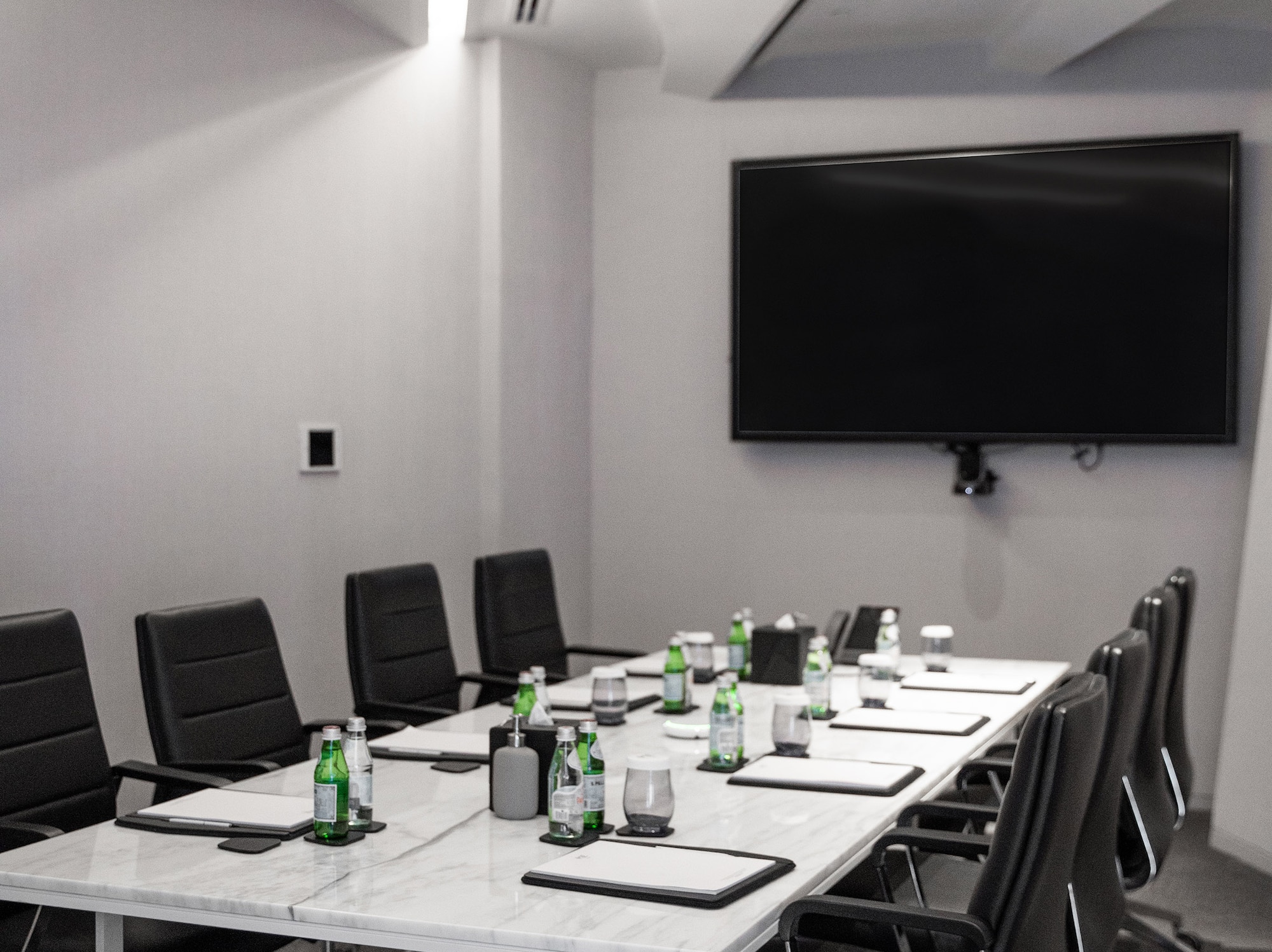 a conference room with a table and chairs