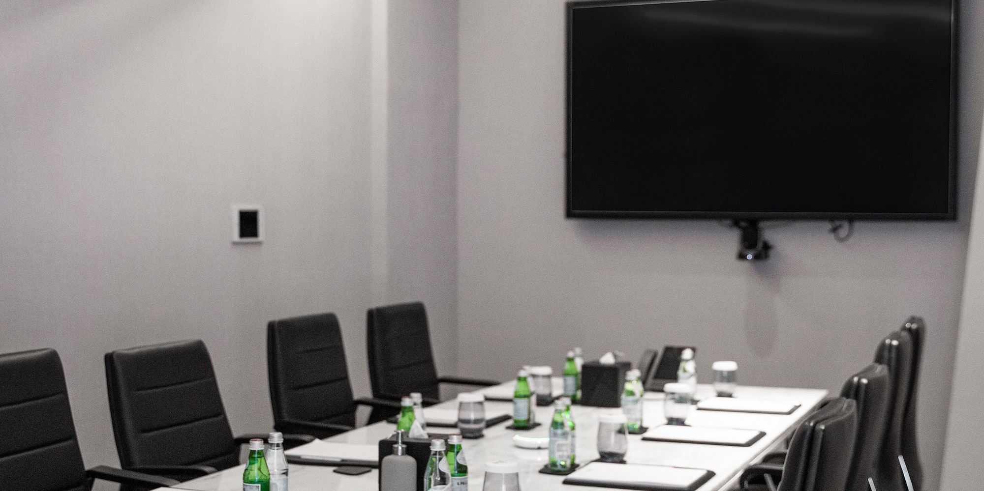 a conference room with a table and chairs