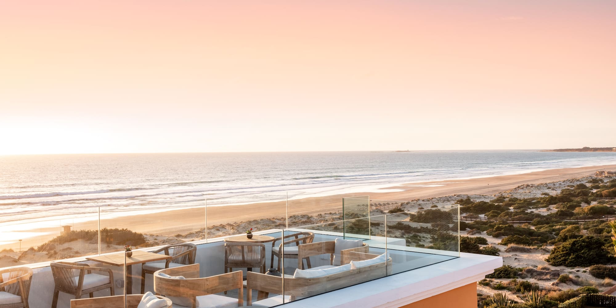a rooftop with a beach and ocean