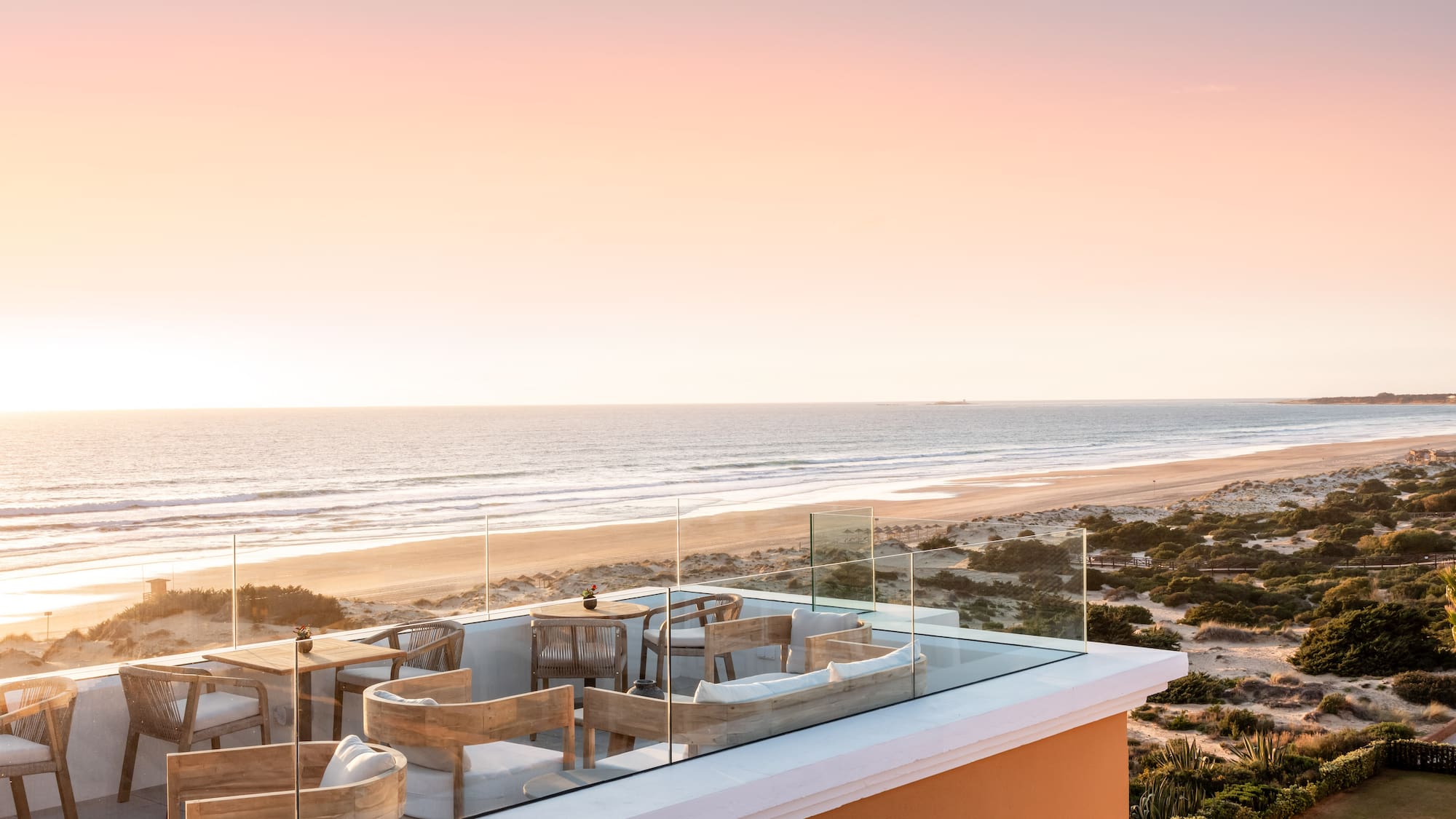 a rooftop with a beach and ocean