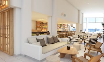 a room with a couch and tables