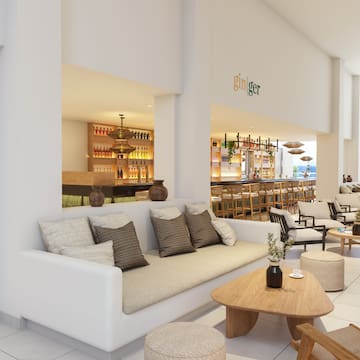 a room with a couch and tables