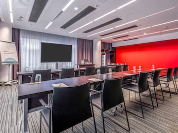 a room with a large table and chairs