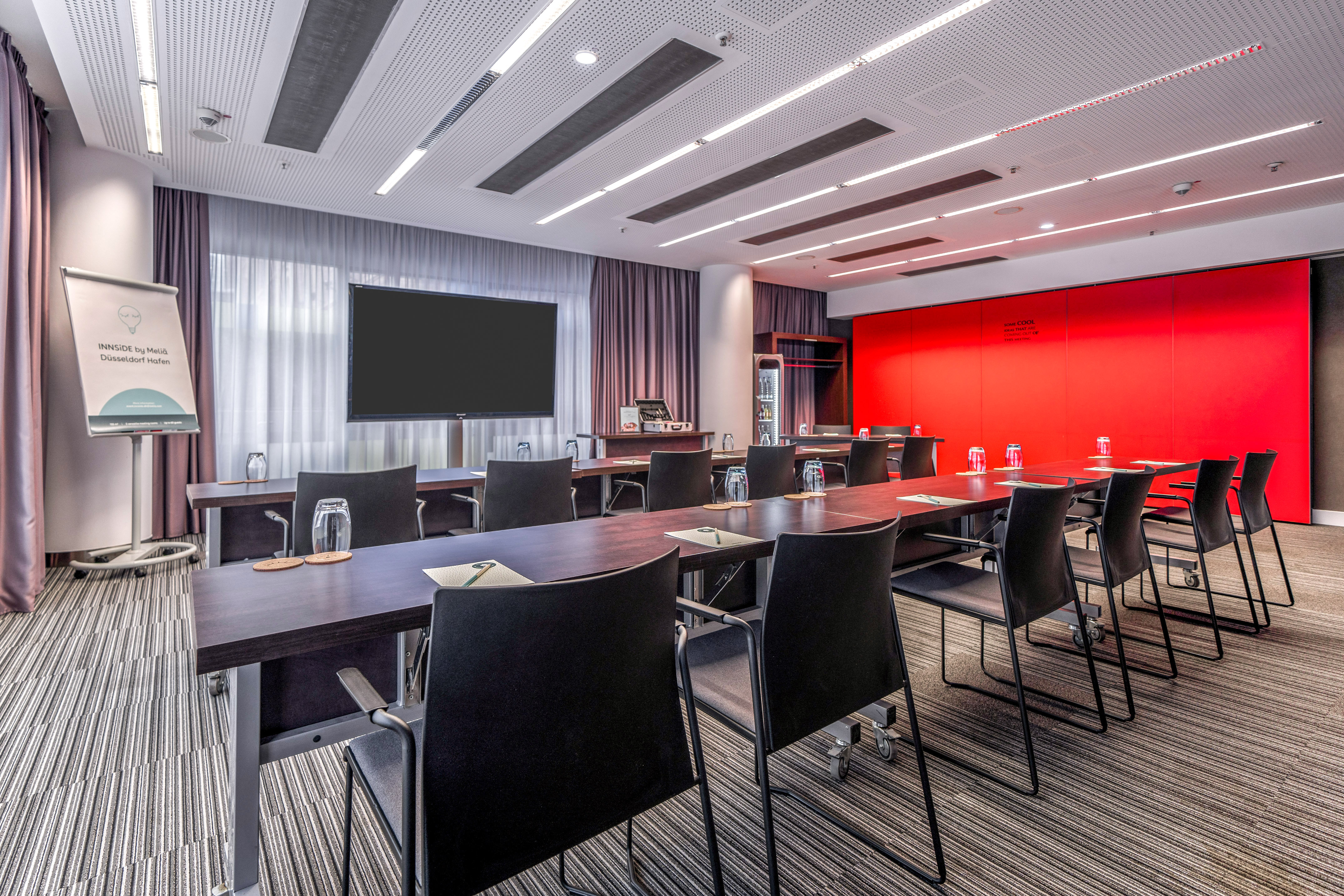 a room with a large table and chairs
