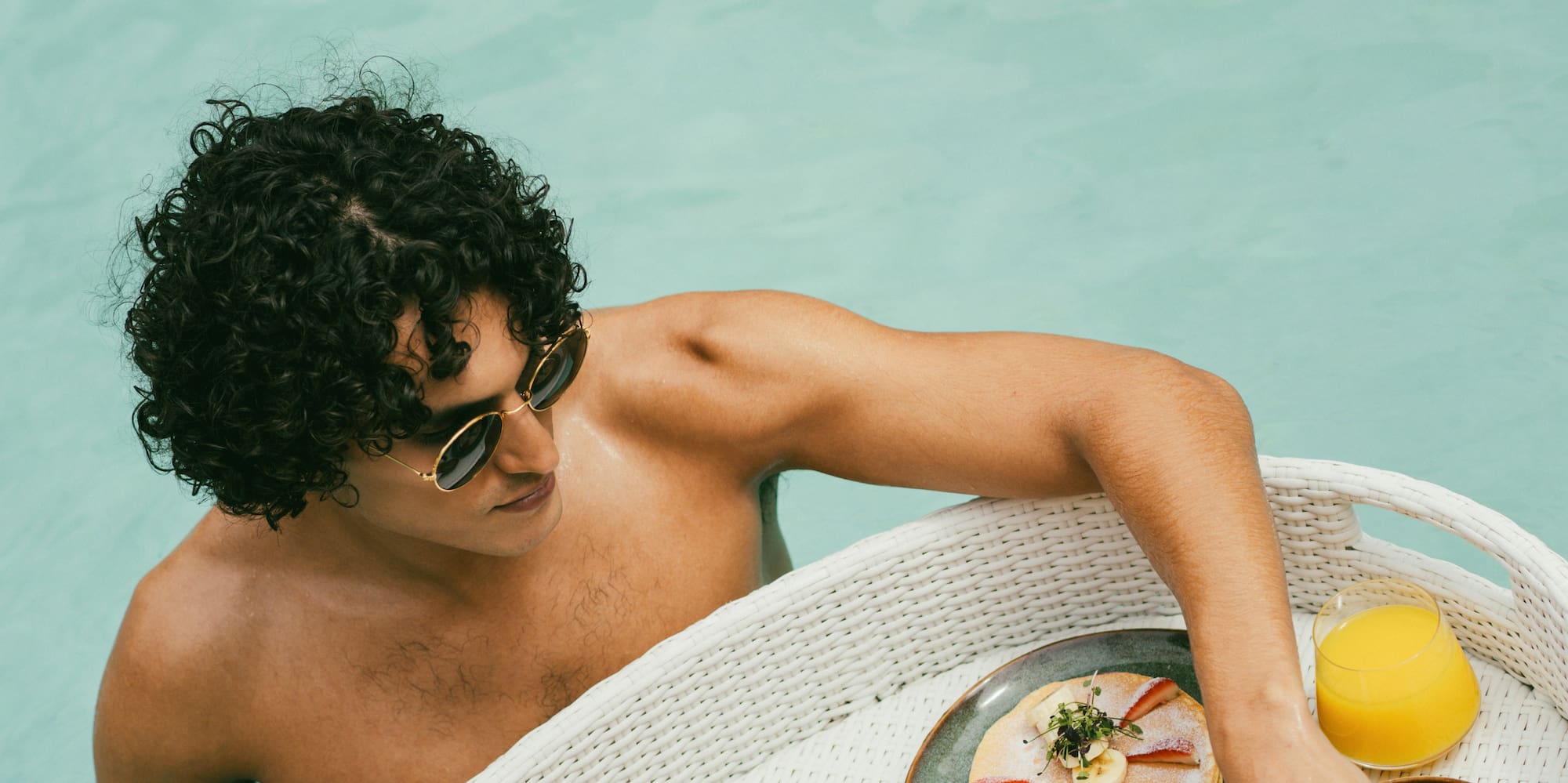 A man enjoying a floating breakfast