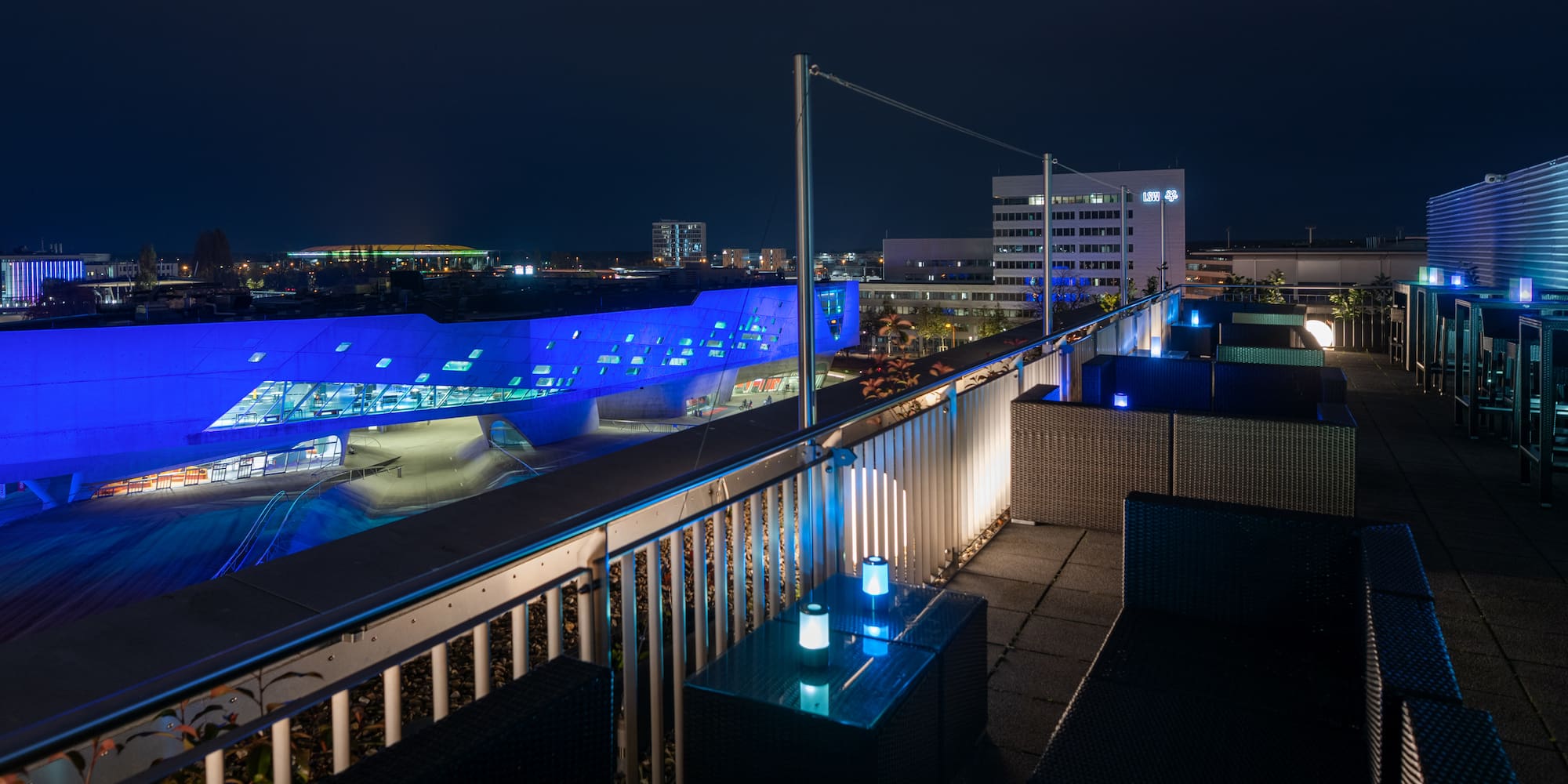 a rooftop view of a city at night
