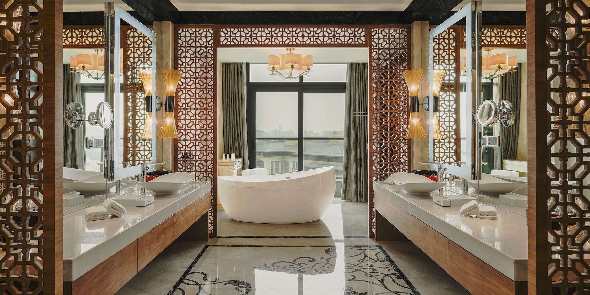 a bathroom with a tub and mirrors