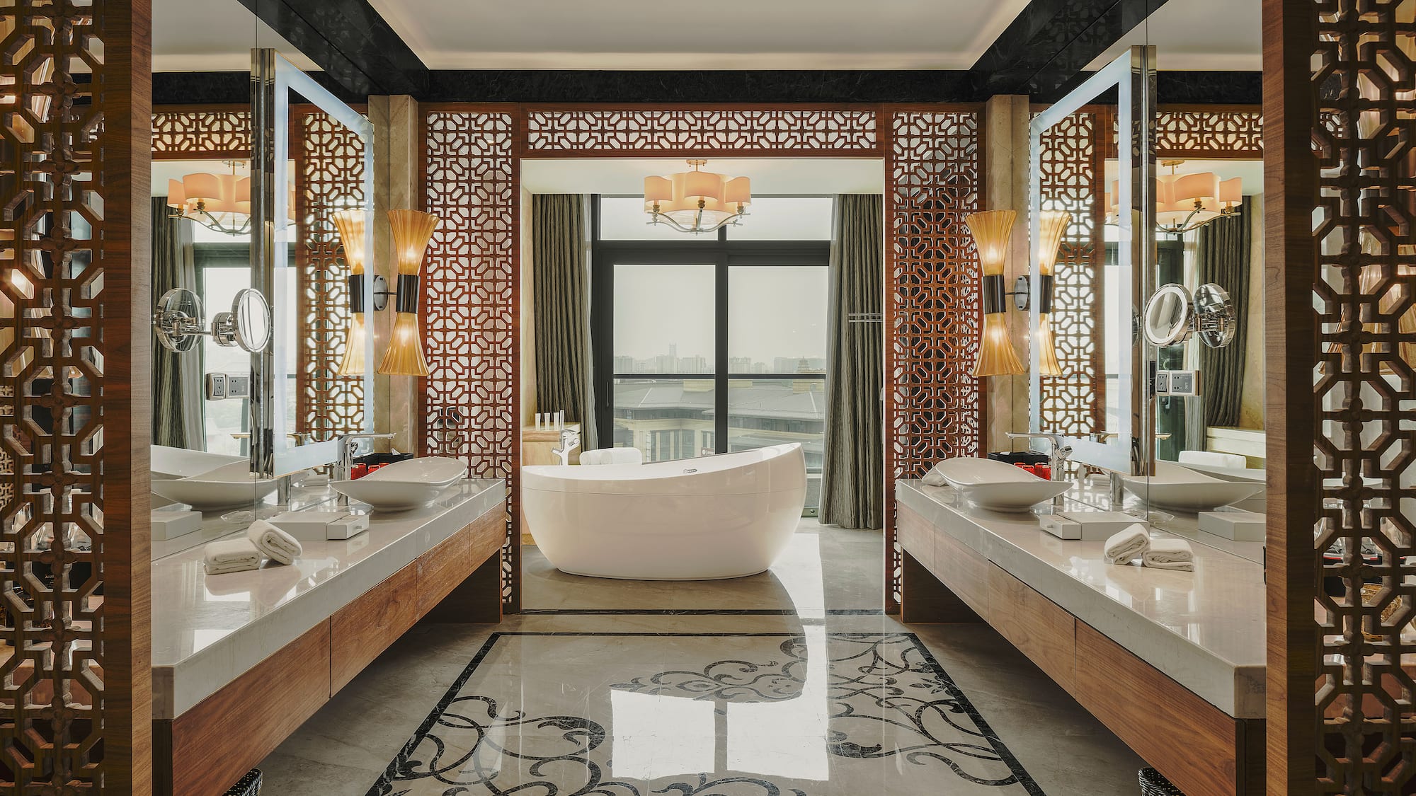 a bathroom with a tub and mirrors