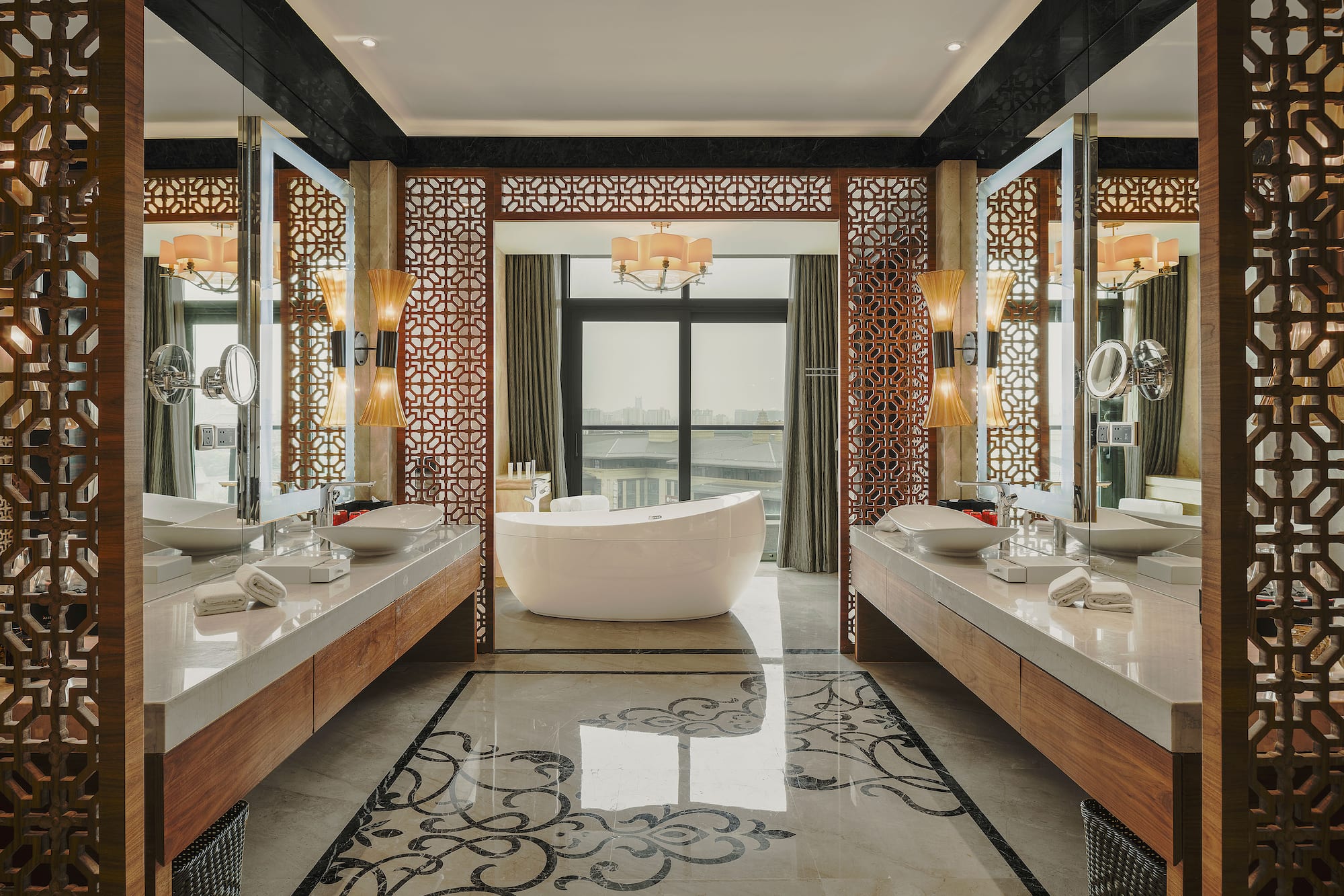 a bathroom with a tub and mirrors