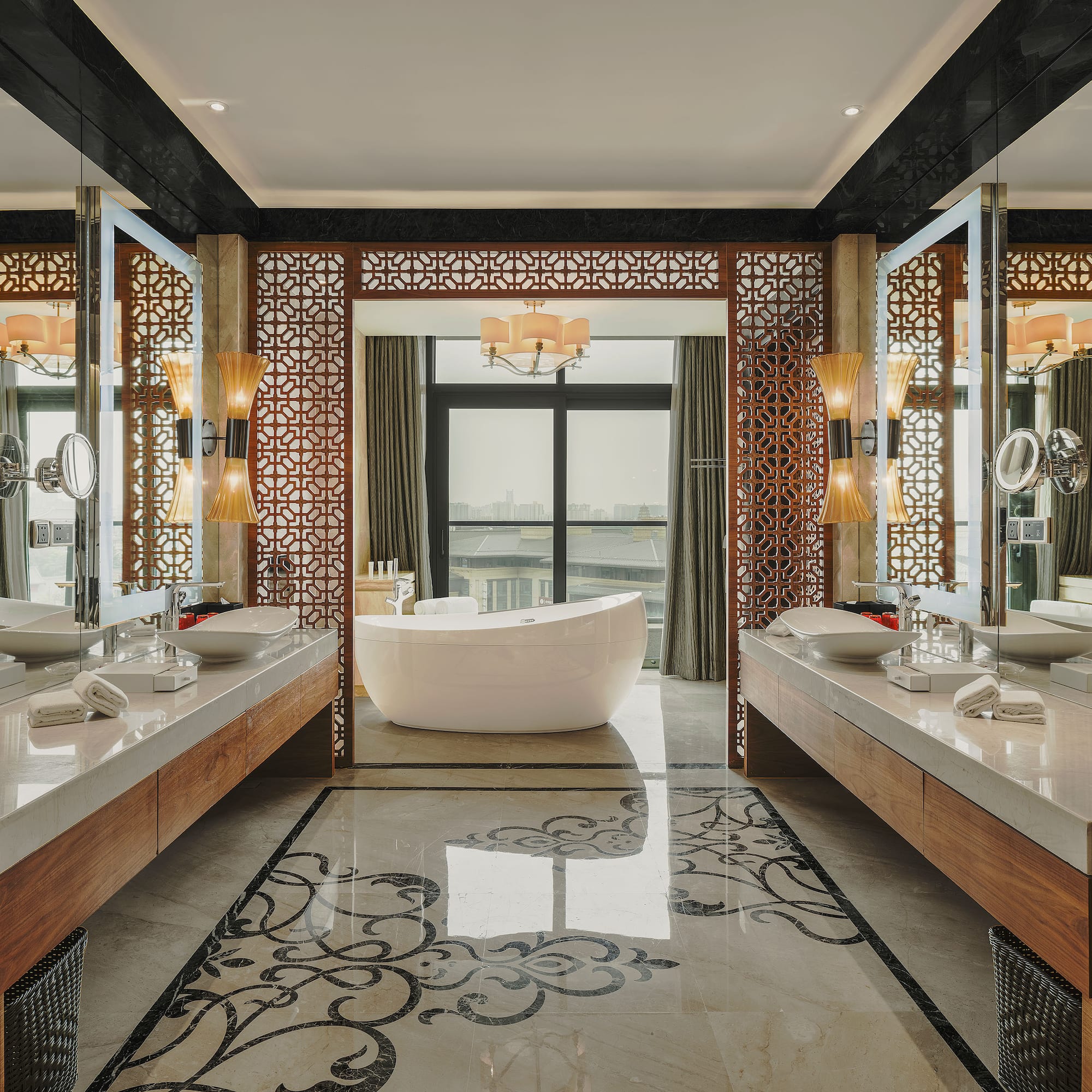 a bathroom with a tub and mirrors