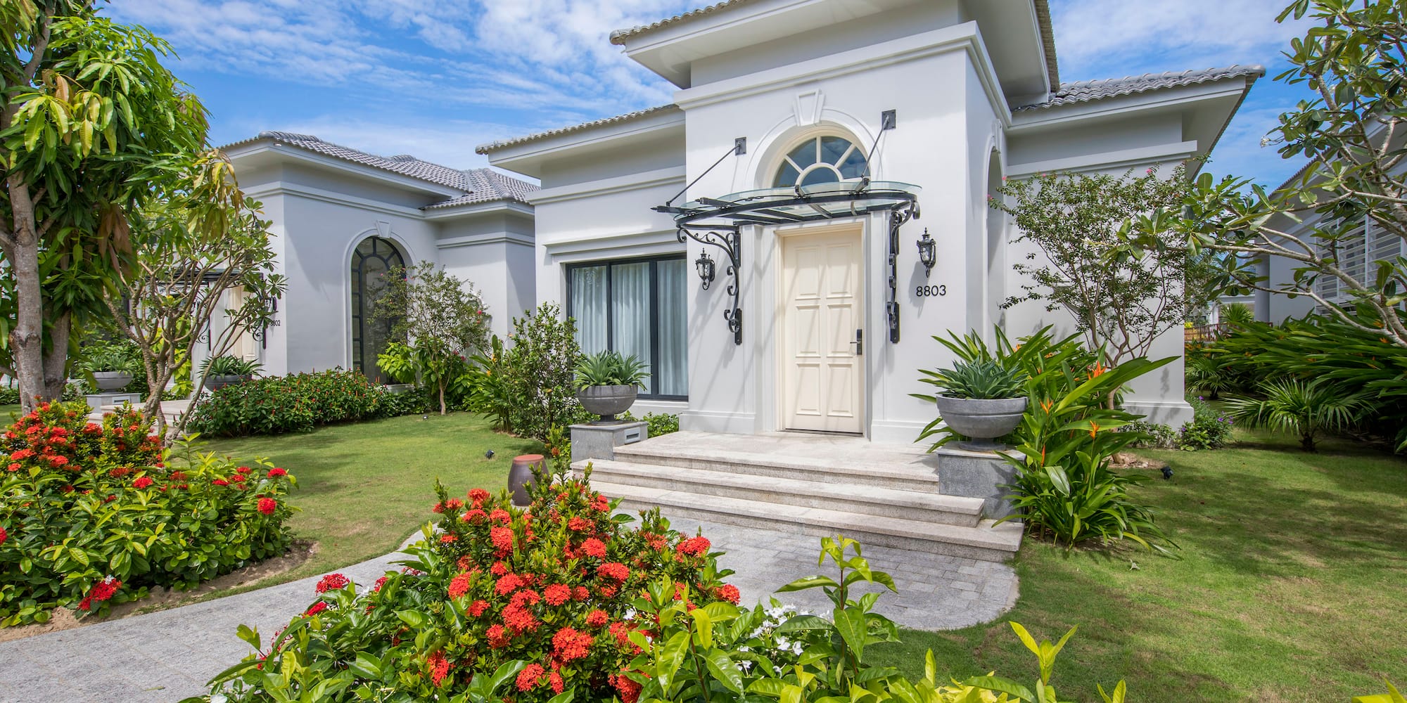 a white house with a garden