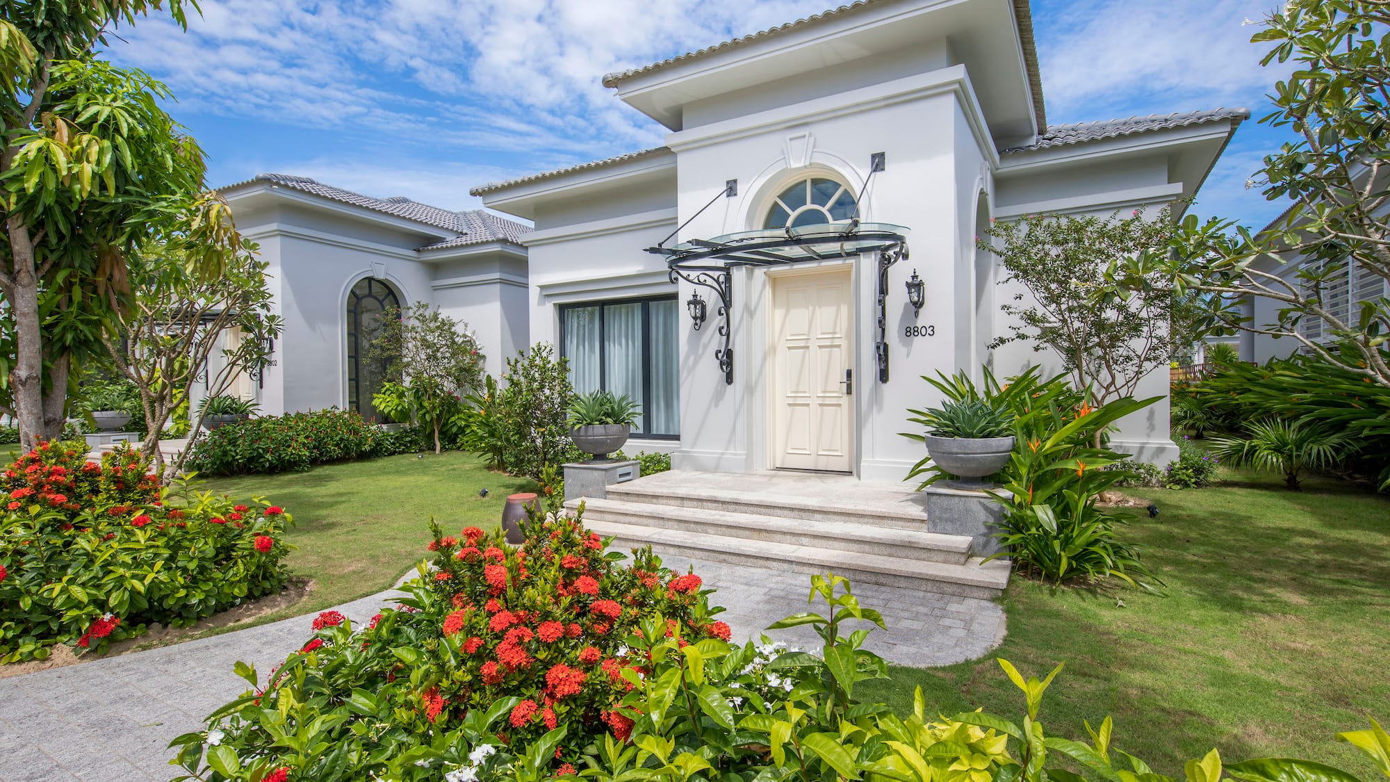 a white house with a garden