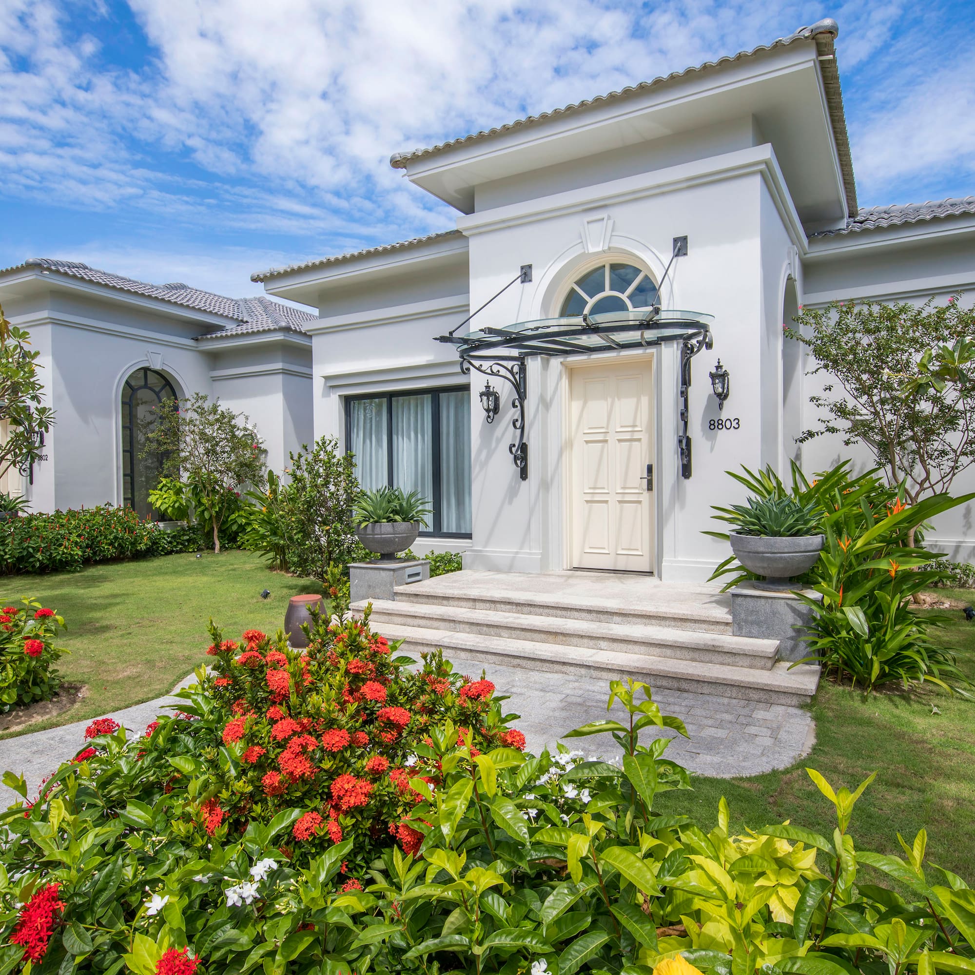 a white house with a garden