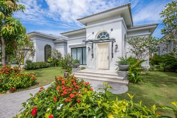 a white house with a garden